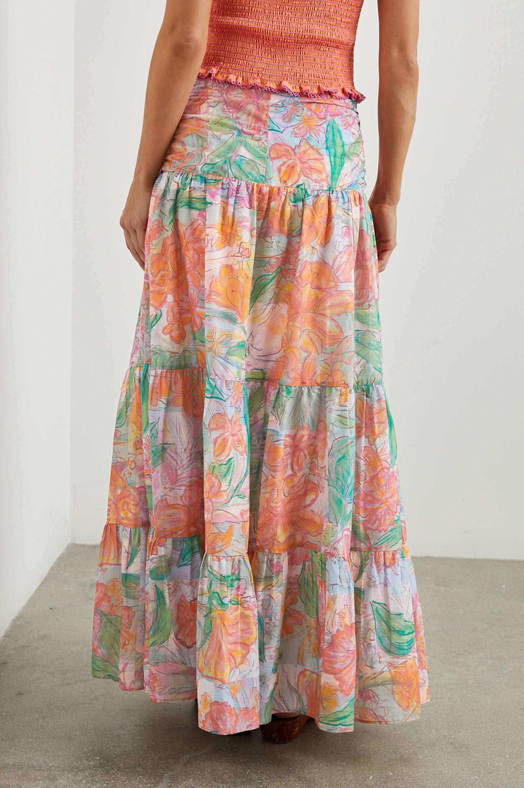 Agatha Maxi Tiered Skirt with Ruching at the Waist in Tropics Colorway, Flowers in Oranges, Pinks and Greens on White - Back View Featured on Model