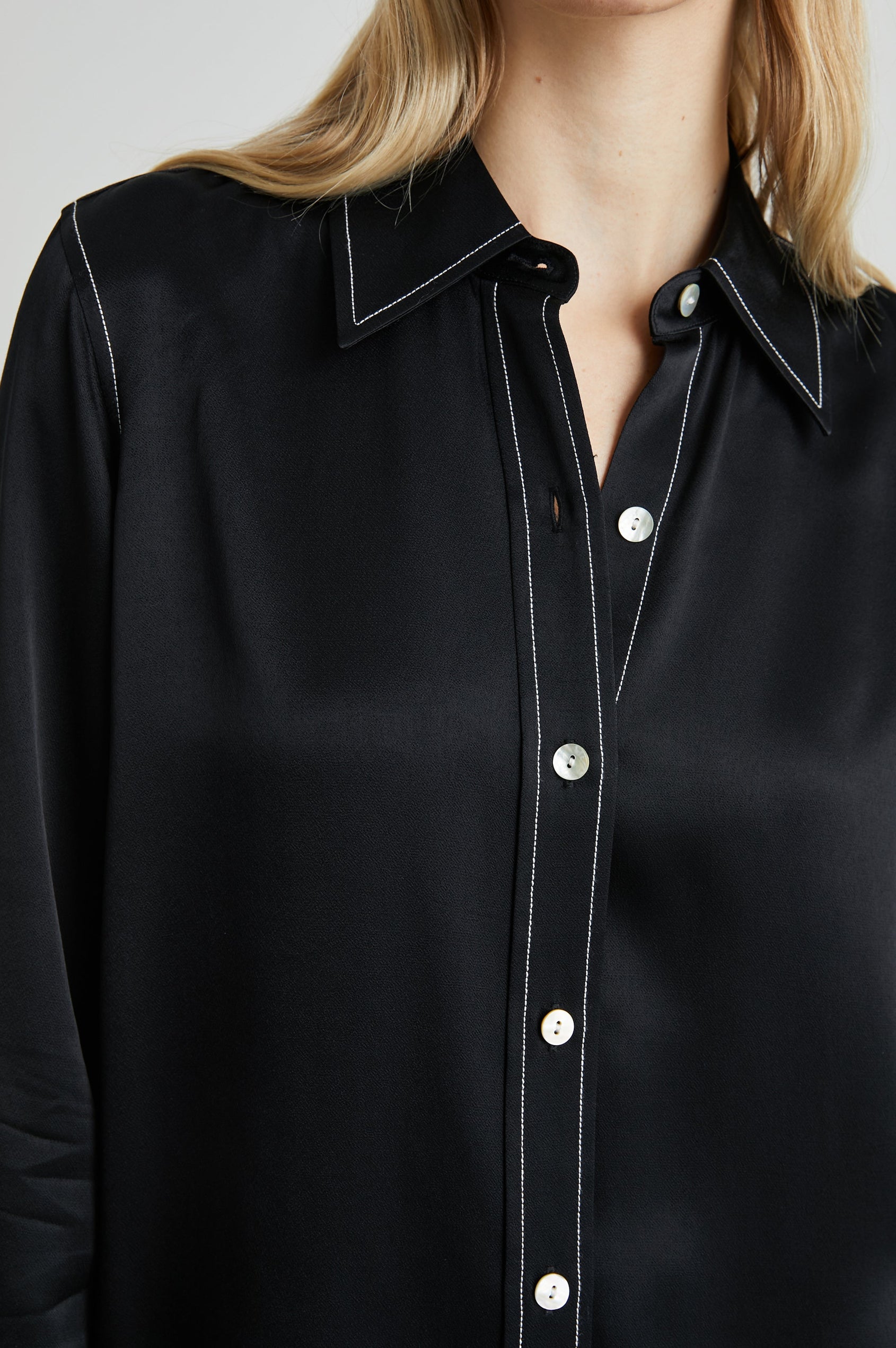 Andrea Long Sleeve Button Up in Black Colorway, with White Stitching at Trim - Front View Featured on Model