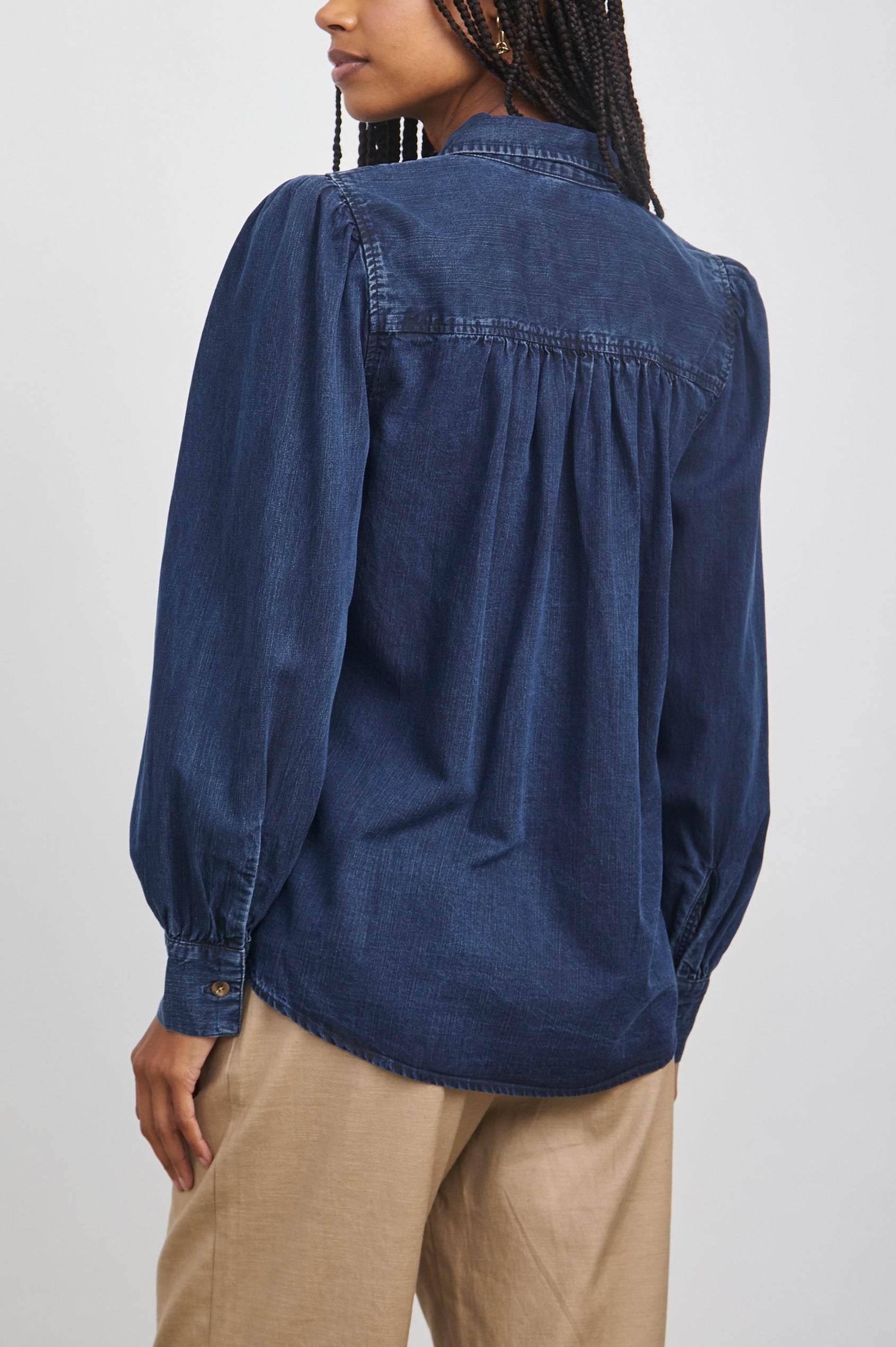 Angelica Long-Sleeve Denim Button Up with Shirring at Cuffs and Puff Sleeves in Dark Vintage Colorway - Back View Featured on Model