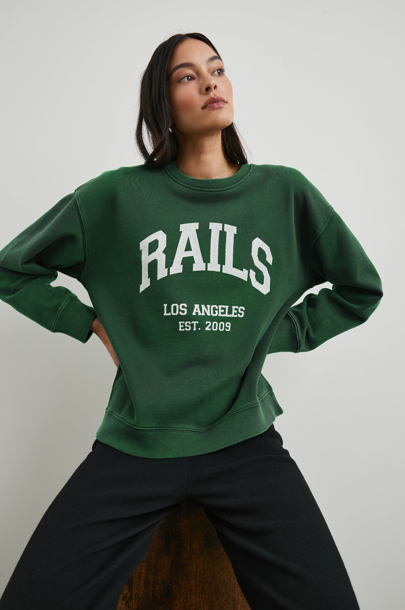 Anniversary Sweatshirt with Crewneck, Text States, Rails Los Angeles Est 2009, in Forest Colorway with White Letters - Front View Featured on Model