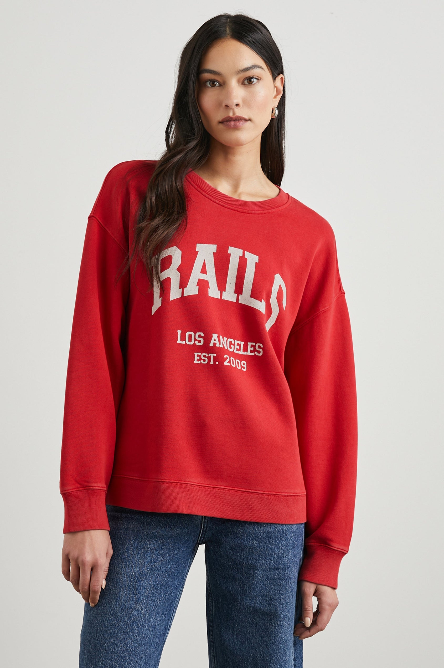 Anniversary Sweatshirt with Crewneck, Text States, Rails Los Angeles Est 2009, in Washed Red Colorway with White Letters - Front View Featured on Model