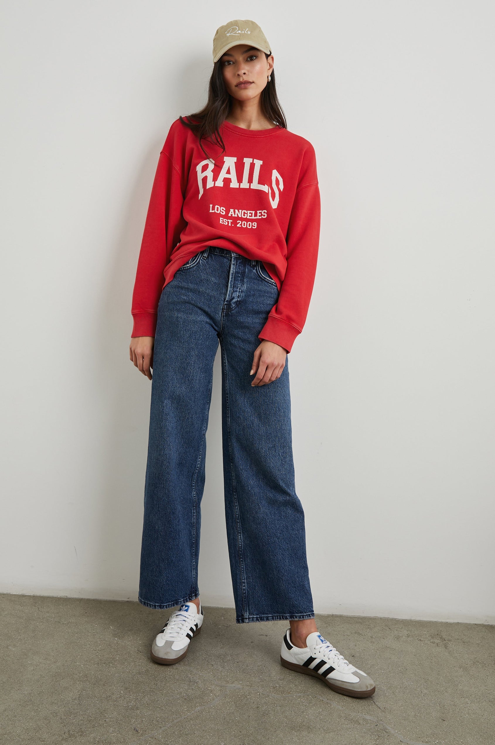 Anniversary Sweatshirt with Crewneck, Text States, Rails Los Angeles Est 2009, in Washed Red Colorway with White Letters - Front Full Body View Featured on Model