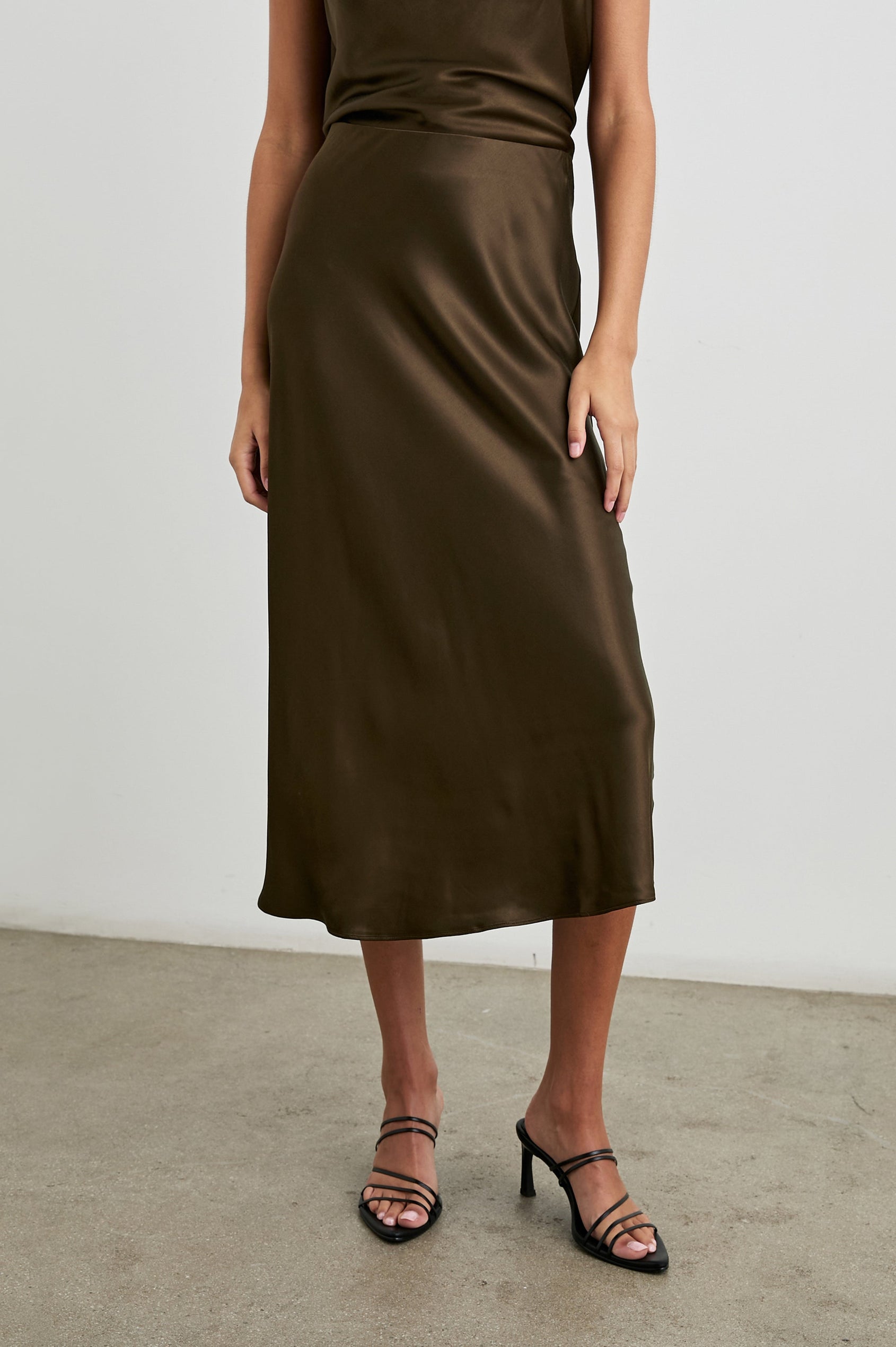 Anya High-waisted Midi Skirt in Dark Moss Colorway - Back View Featured on Model
