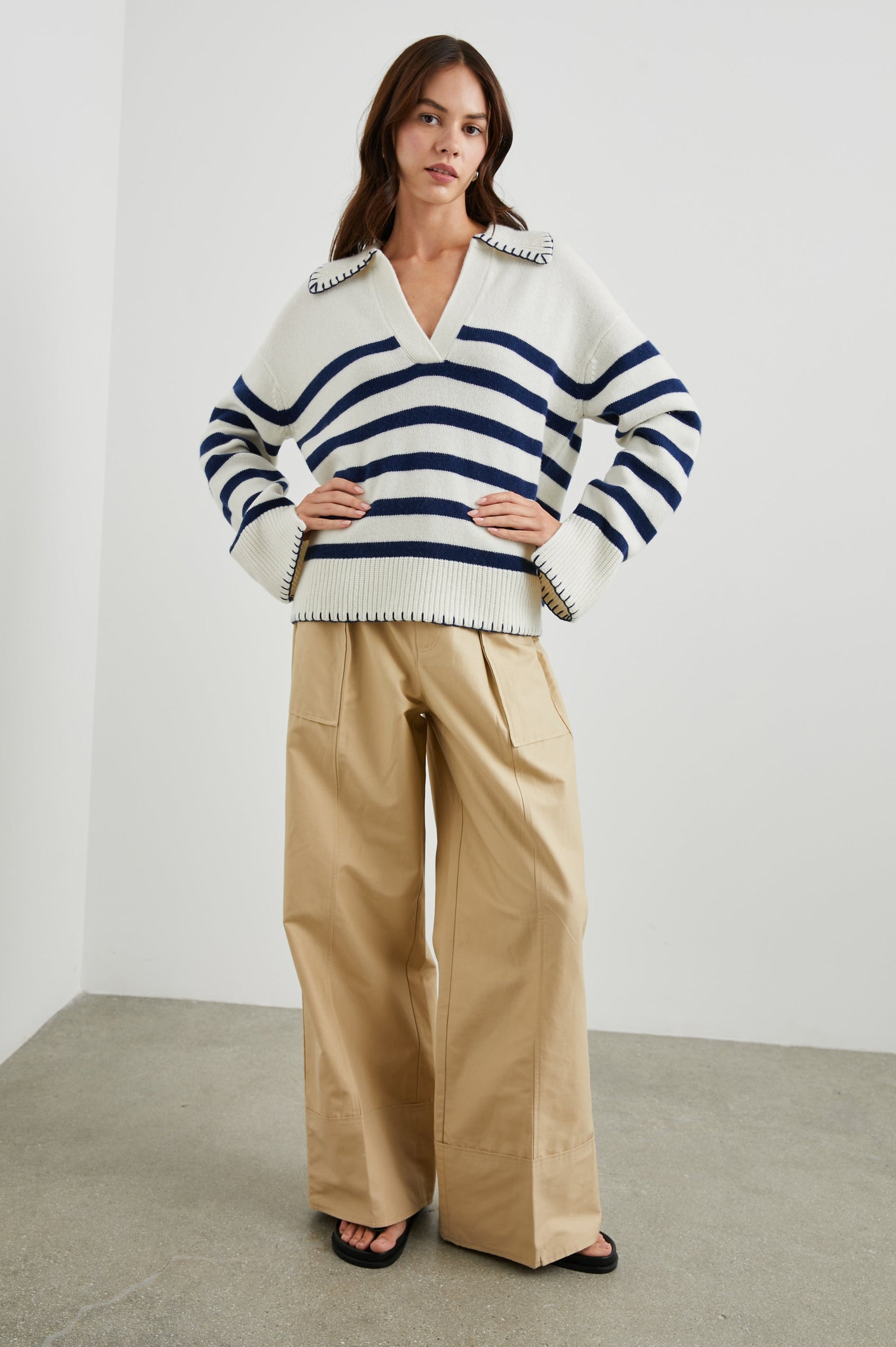 Athena Long-Sleeve Sweater with a Flat Collar V Neckline, Ribbed Cuffs and Hem and Contrast Stitching at the Cuffs and Hem in Ivory Navy Stripe Colorway, Horizontal Stripes - Front Full Body View Featured on Model