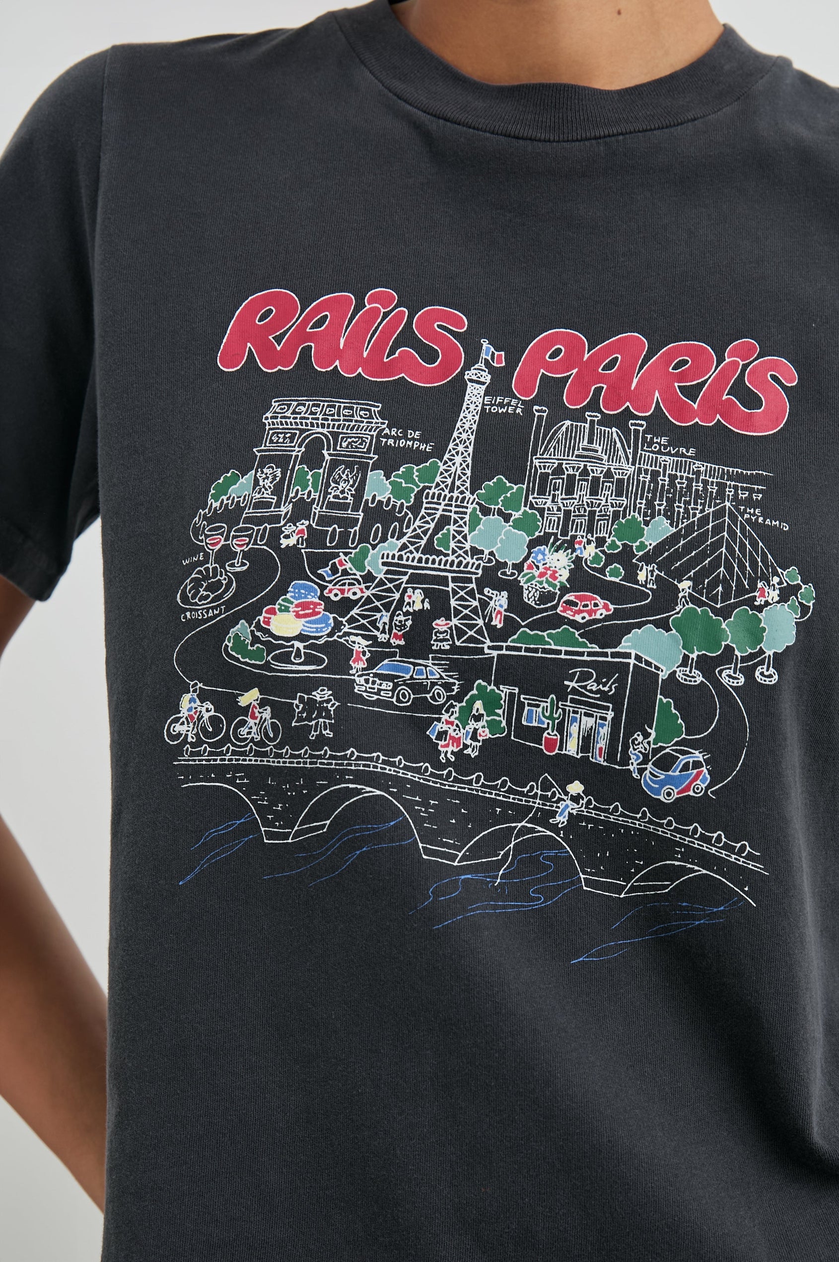 Boyfriend T-Shirt with a Crew Neck, Paris Images and the text, Rails Paris in Rails Paris Colorway, with text and images in mostly Pink and white on Black - Front View Featured on Model