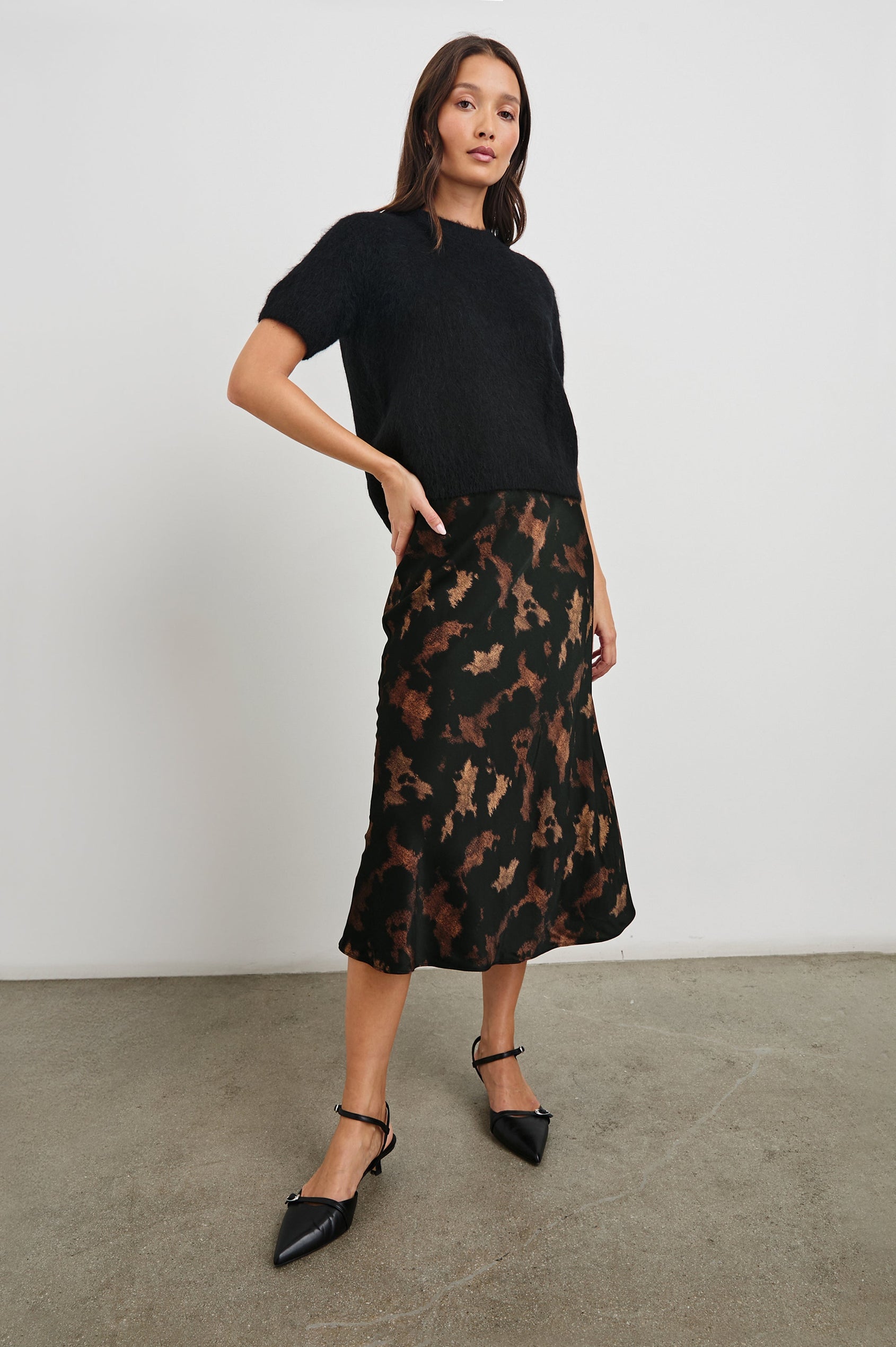 Briar Short-Sleeve Top with a Crew Neck and Ribbed Trim in Black Colorway - Front Full Body View Featured on Model