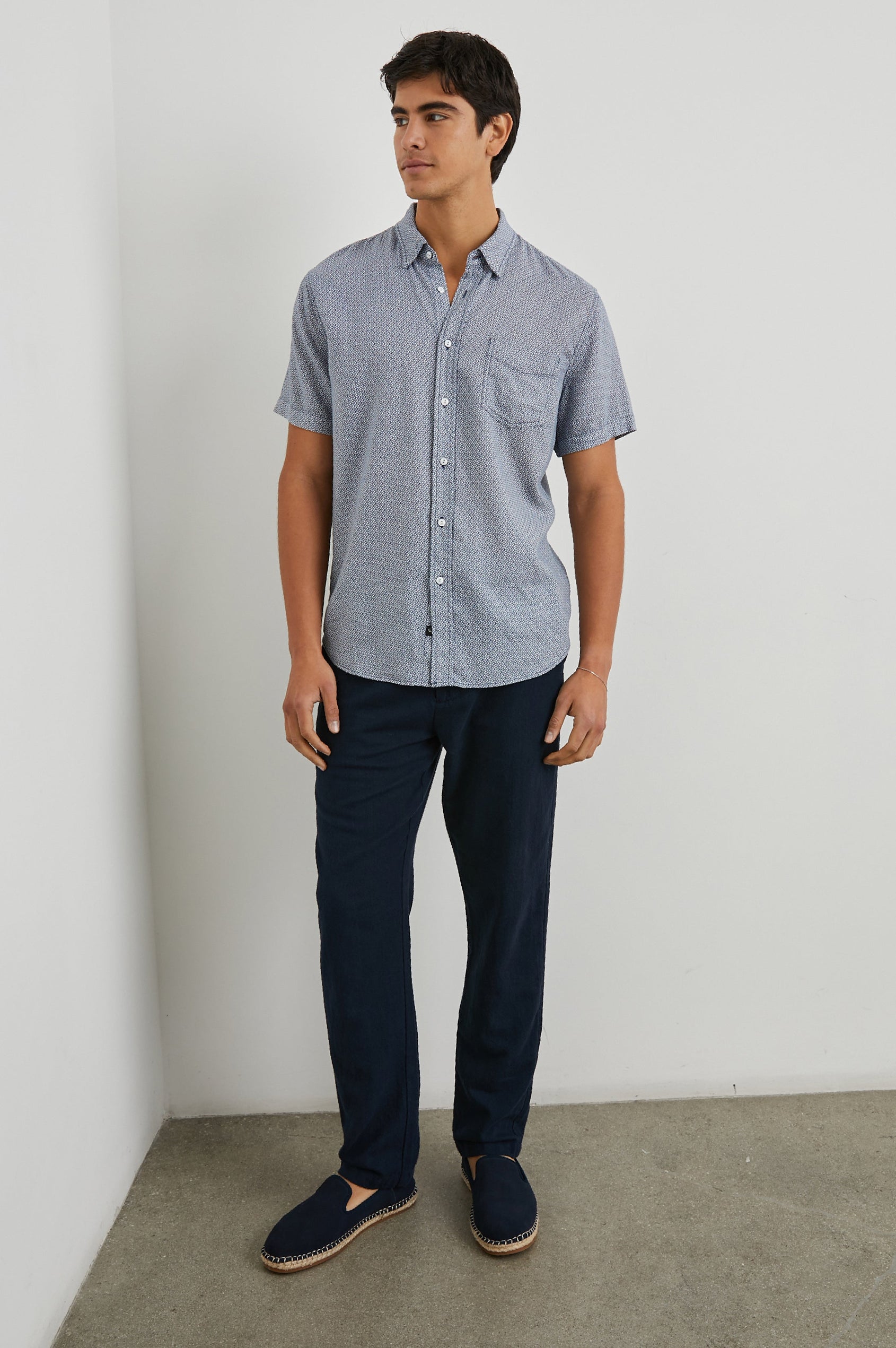 Carson Short Sleeve Button Up with a Chest Patch Pocket in Crown Jewel Sapphire Colorway, with a Small Diamond Pattern - Front Full Body View Featured on Model