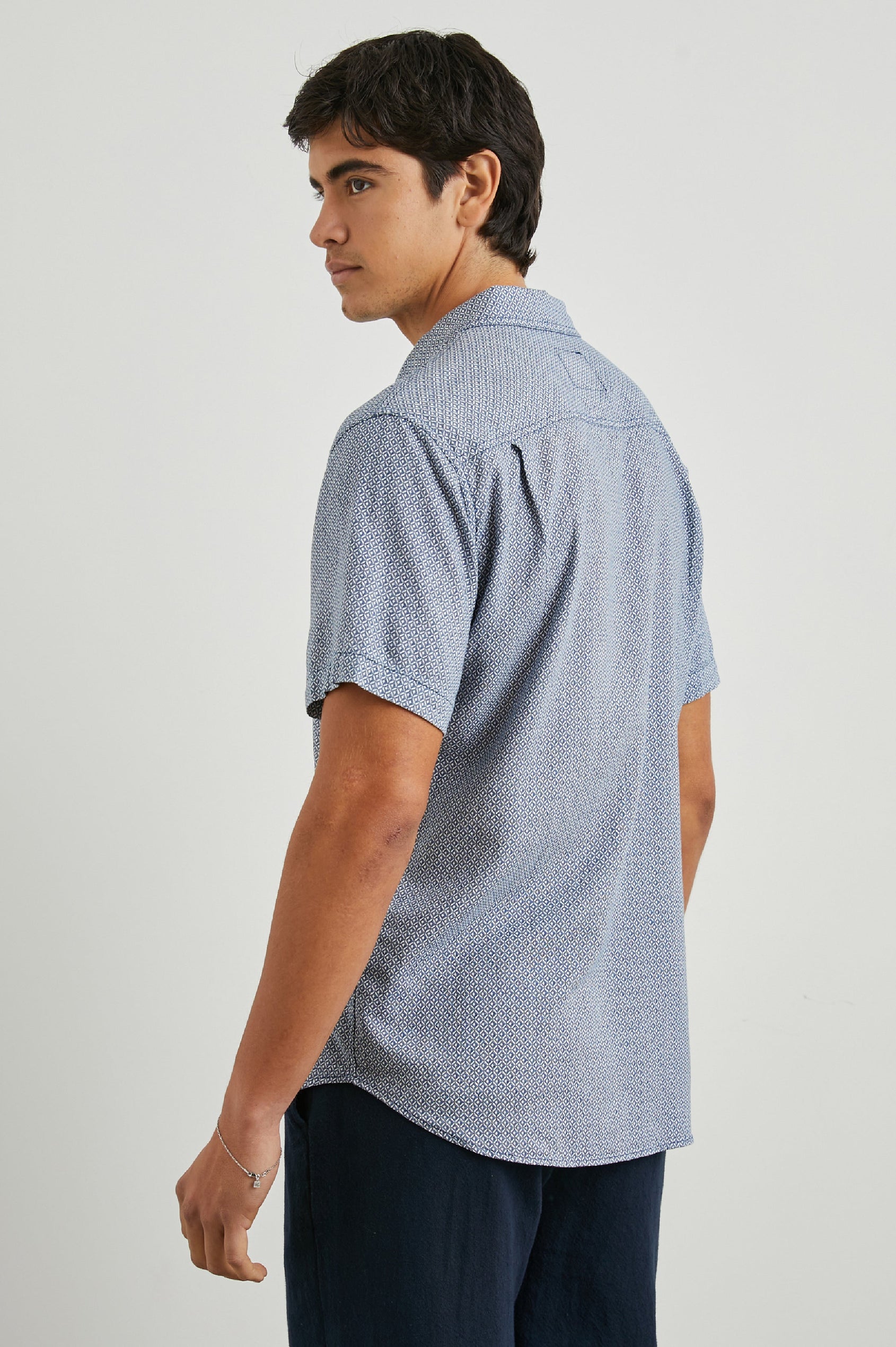 Carson Short Sleeve Button Up with a Chest Patch Pocket in Crown Jewel Sapphire Colorway, with a Small Diamond Pattern - Back View Featured on Model