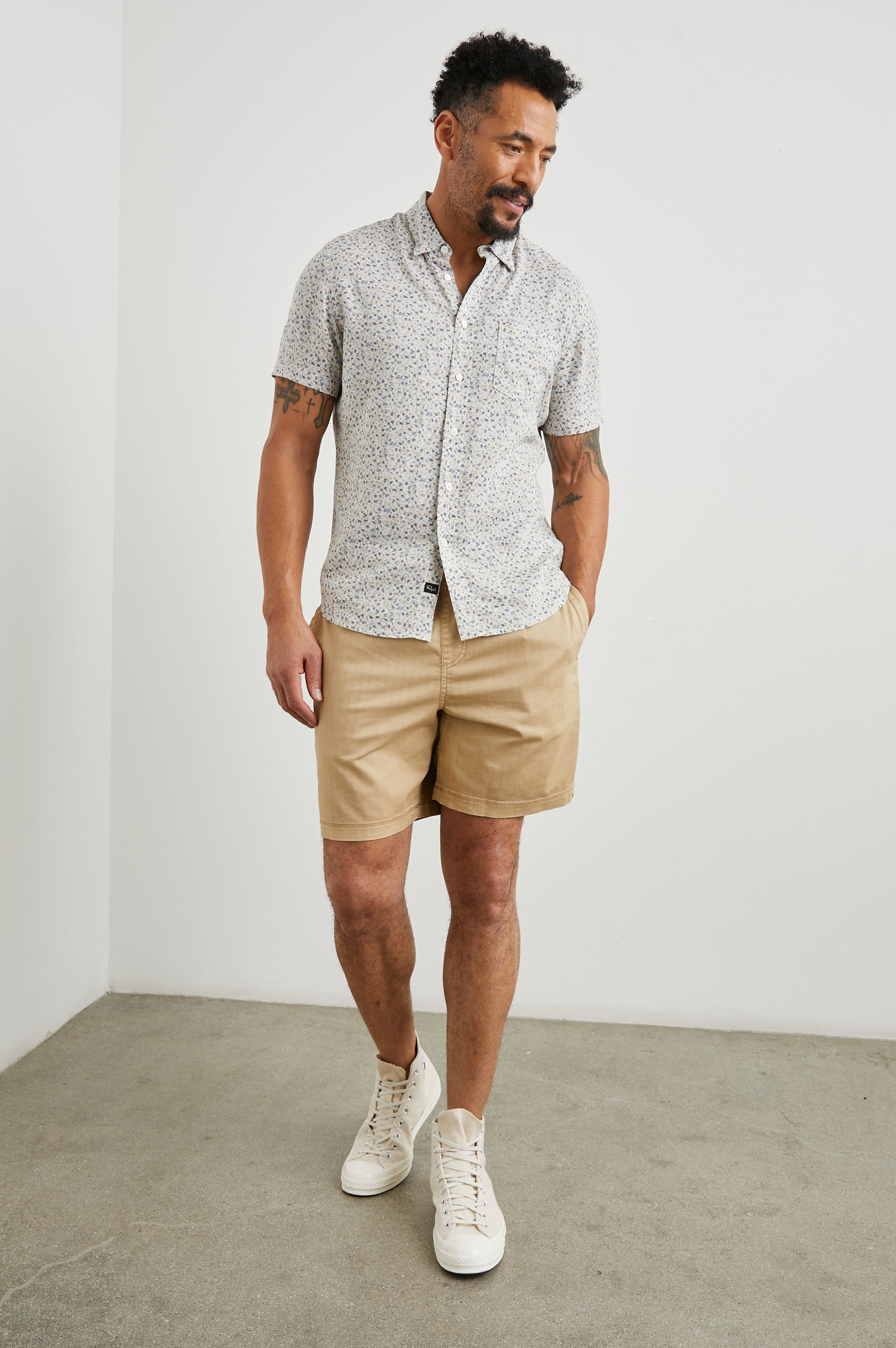 Carson Short Sleeve Button Up with a Chest Patch Pocket in Spring Blossom Parchment Colorway, Blossoms in Blue and Tan on Parchment - Front Full Body View Featured on Model