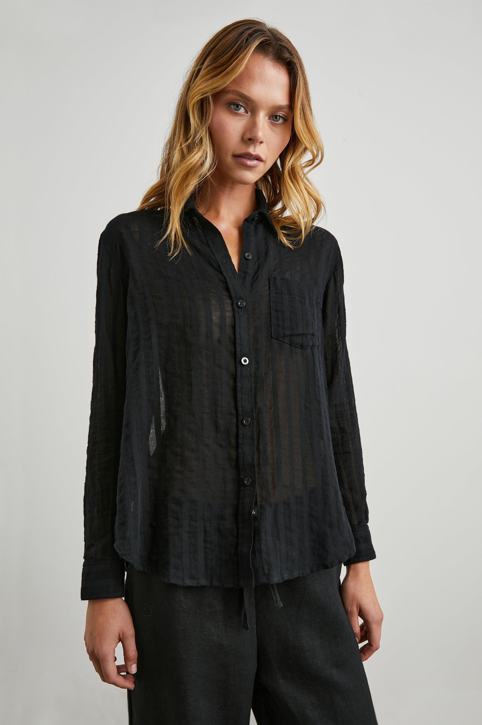 Charli Long-Sleeve Button up with a Chest Patch Pocket in Black Shadow Stripe Colorway, with Vertical Solid and Gauzy Black Stripes - Front View Featured on Model