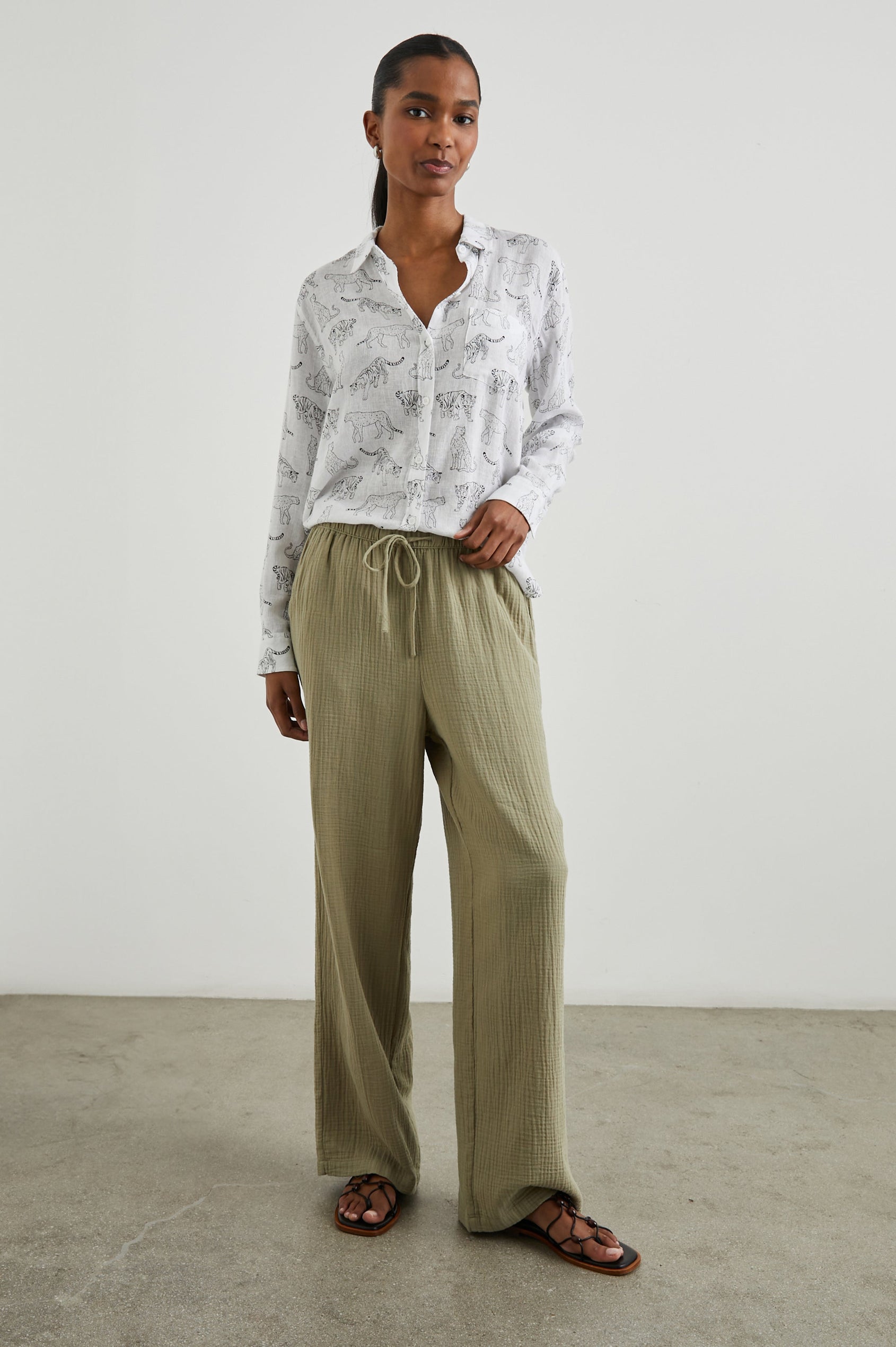 Charli Long-Sleeve Button up with a Chest Patch Pocket in Ivory Jungle Cats Colorway, with black jungle cats on ivory - Front Tucked Full Body View Featured on Model