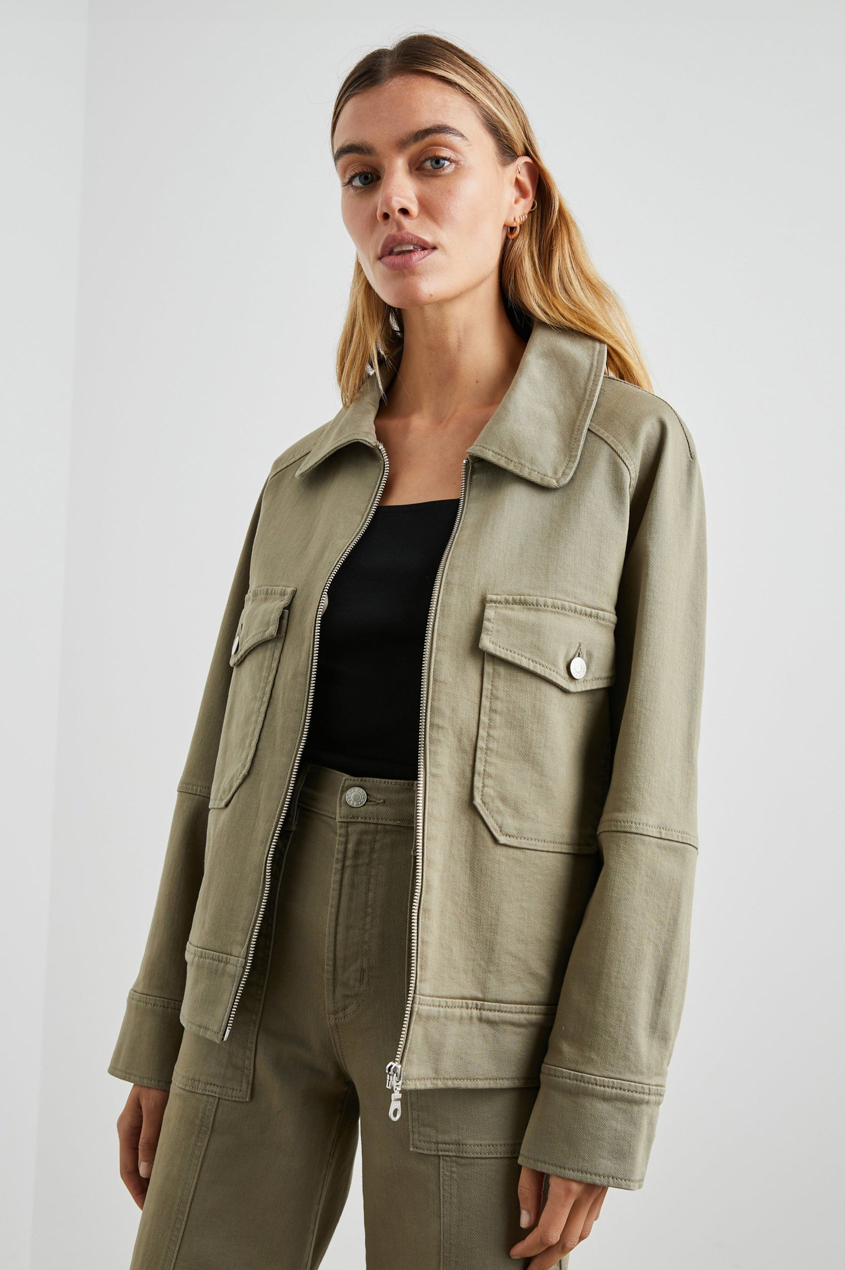 Cheyenne Denim Zip-Up Jacket with Two Chest Buttoned Flap Pockets in Washed Olive Colorway - Front View Featured on Model