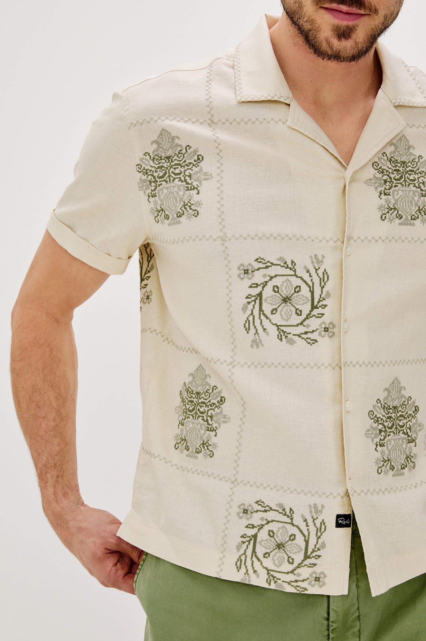 Clairo Button Front Shirt with a Relaxed Lapel, Cuffed Short Sleeves and Embroidery throughout in Cream Quilt Squares Colorway. Front Detail View Shown on Model.