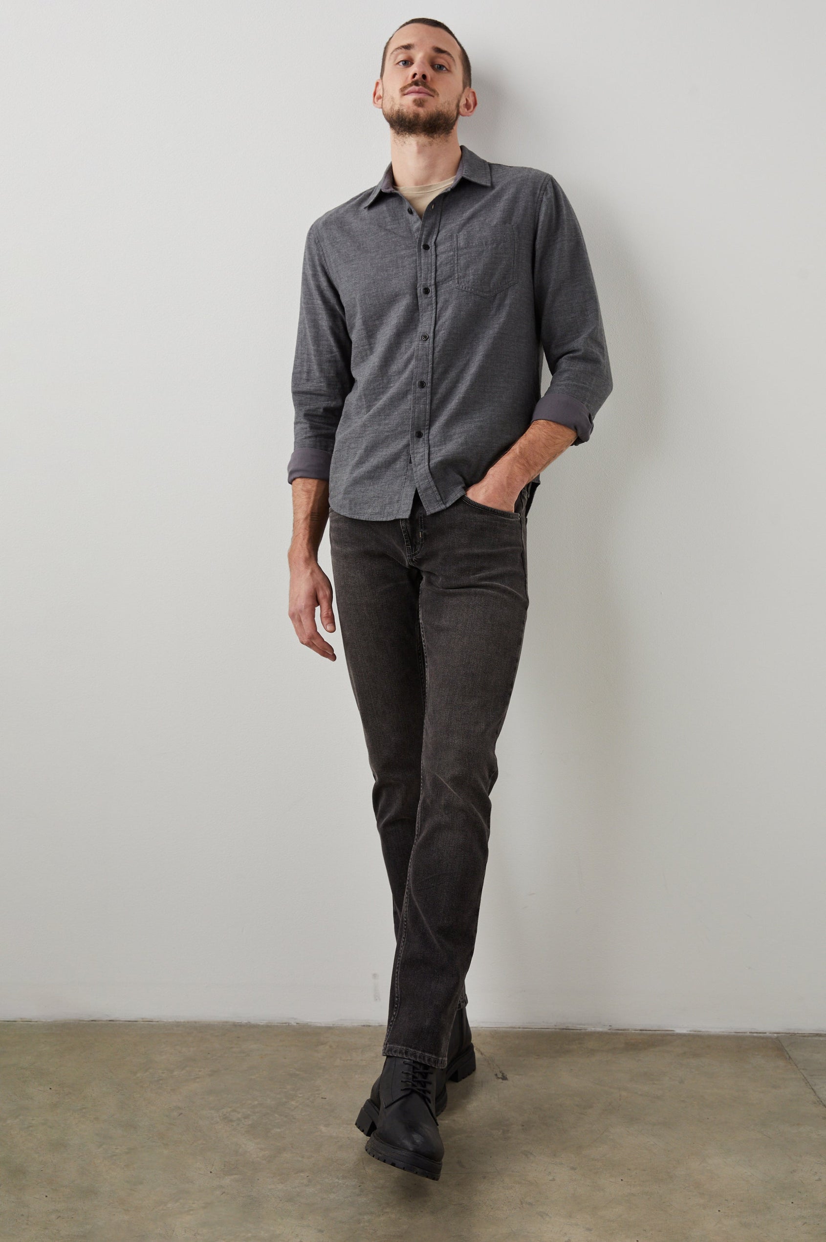 Clayton Slim Straight Jeans with Belt Loops, Two Front Pockets plus a Coin Pocket and Two Back Patch Pockets in Reever 5 Year Colorway, a Washed Black - Front Full Body View Featured on Model
