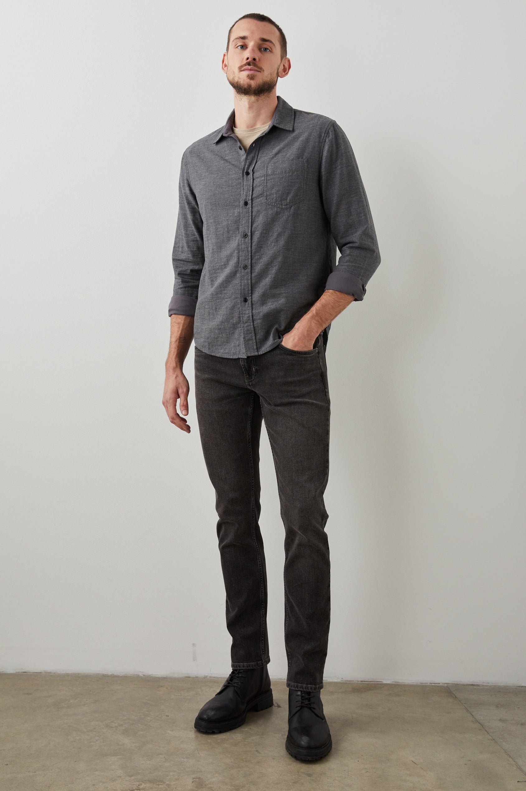 Clayton Slim Straight Jeans with Belt Loops, Two Front Pockets plus a Coin Pocket and Two Back Patch Pockets in Reever 5 Year Colorway, a Washed Black - Front Full Body View Featured on Model