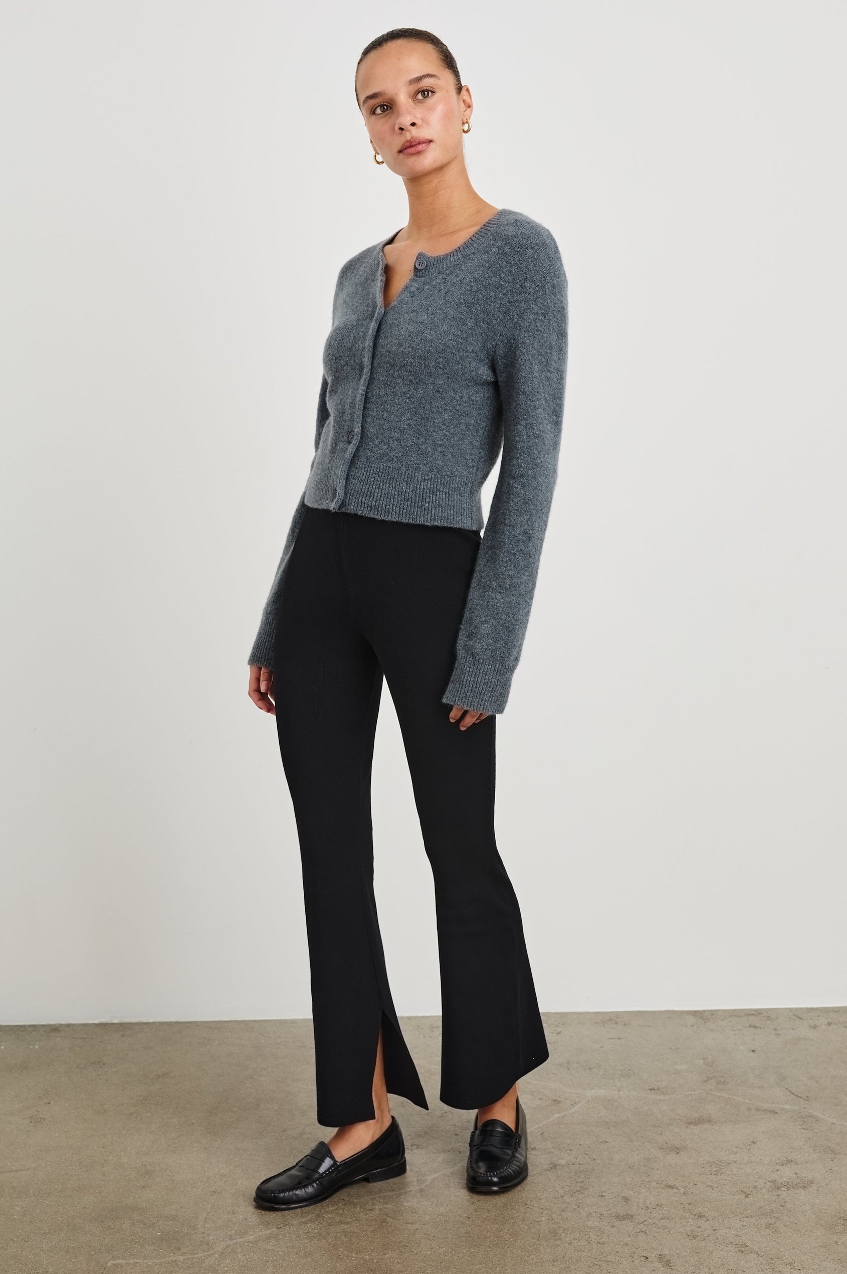Cleo Sweatpant With A Wide Leg and Slit At Bottom Hem In Black - Full Front Body View Featured On Model