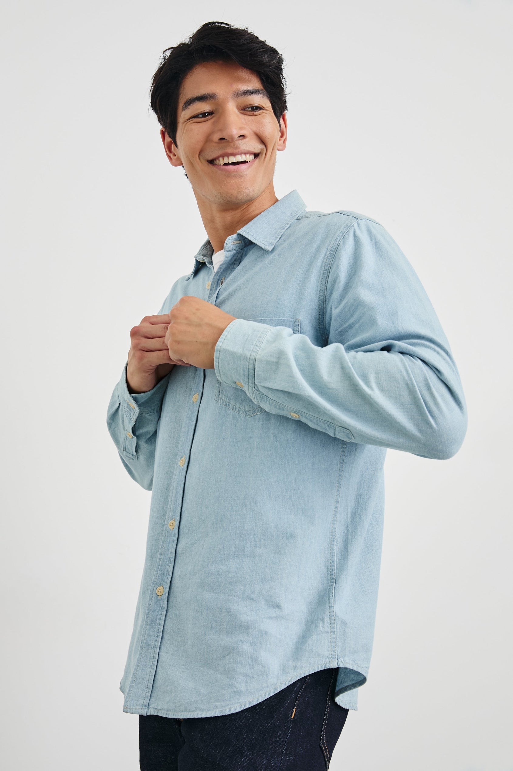 Colton Long-Sleeve Denim Button Up with a Chest Patch Pocket in Medium Vintage Wash Colorway - Front View Featured on Model