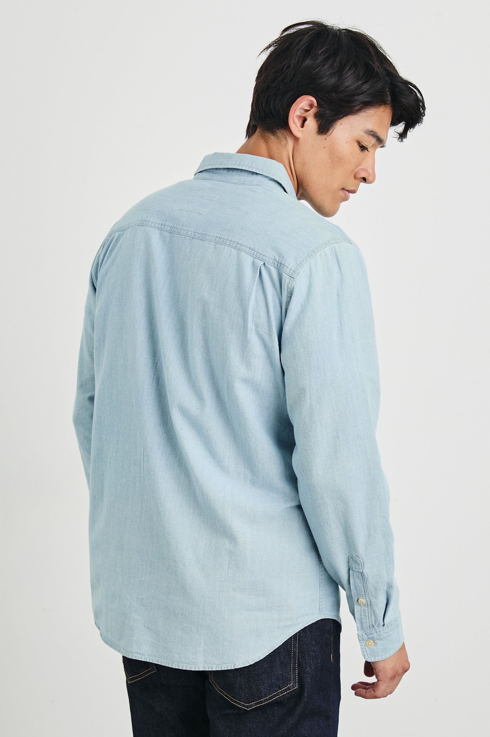 Colton Long-Sleeve Denim Button Up with a Chest Patch Pocket in Medium Vintage Wash Colorway - Back View Featured on Model
