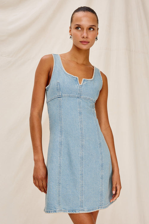 Cove Denim Tank Dress with a Scoop Split neck, Empire Bust, A-line and Above-Knee Length in Capri Colorway. Front View Shown on Model.
