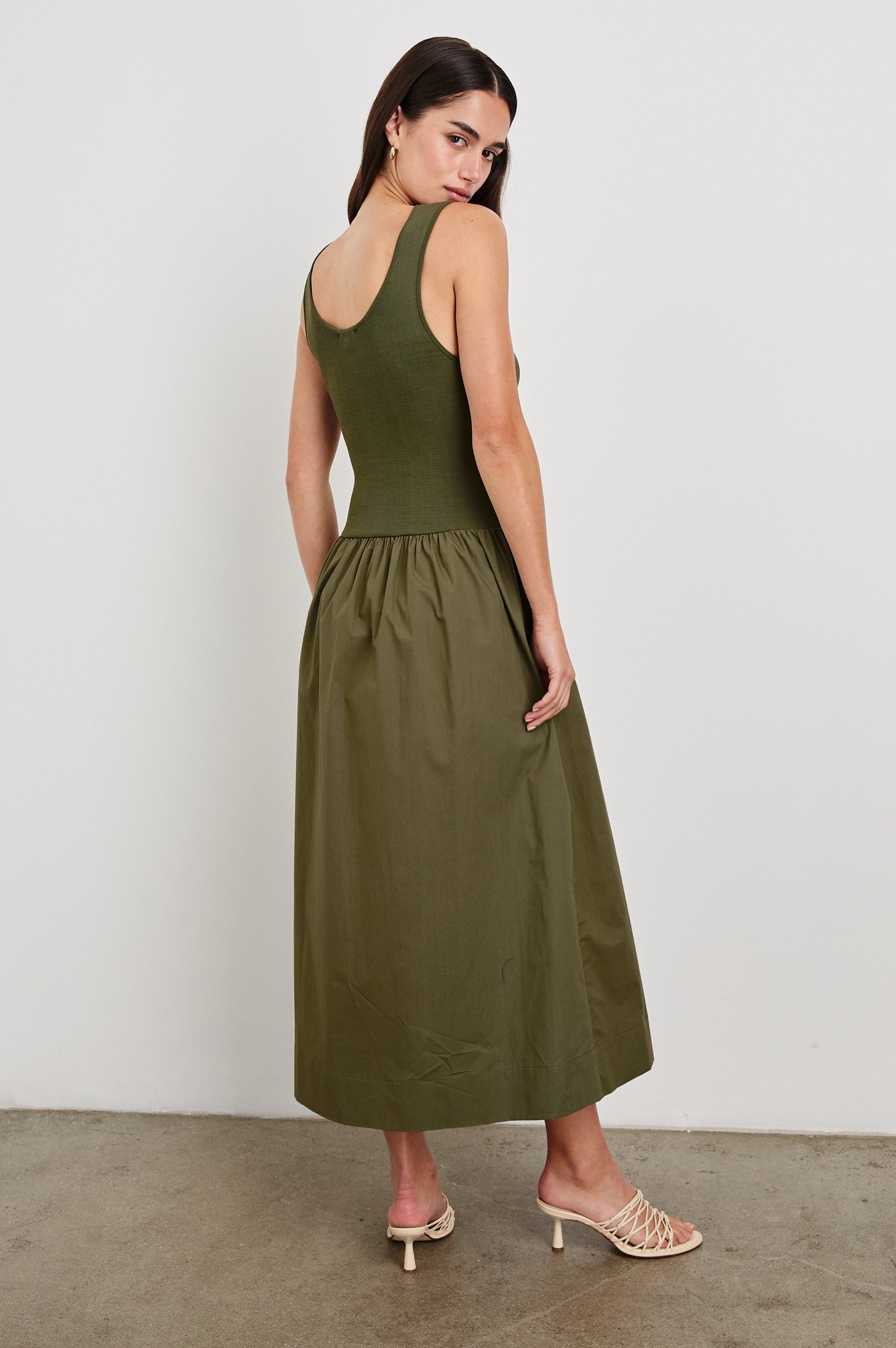 Dia tank midi dress with scoop neck and fitted bodice in Olive colorway - back view on model