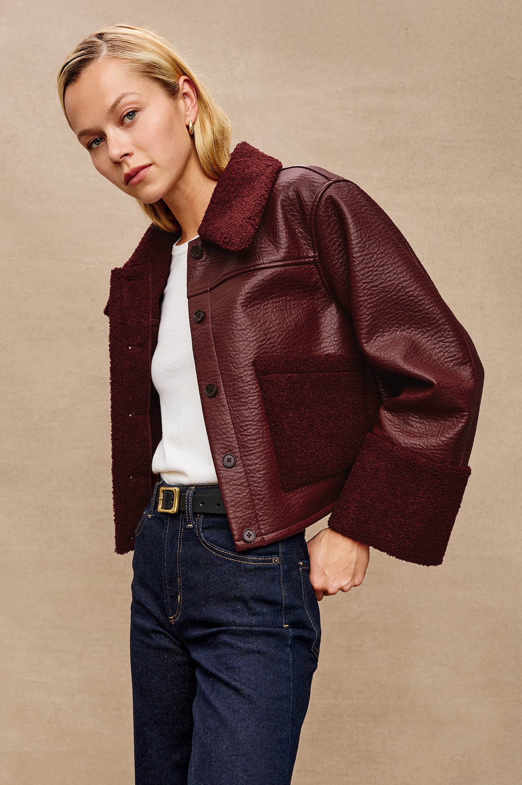 Dria Jacket with Button Closure, Two Front Patch Pockets and Faux Shearling at the Pockets, Cuffs, Collar and Opening in Maroon Shearling Colorway, Front View Featured on Model