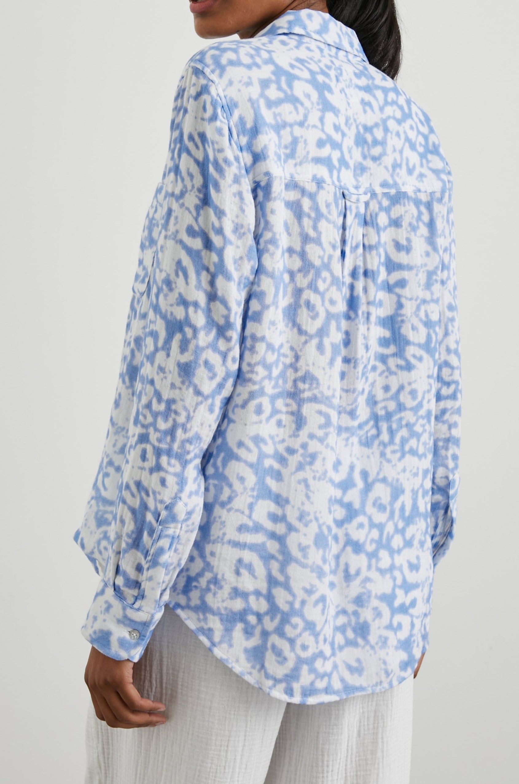 Ellis Long-Sleeve Button Down with Cuffs and a Chest Pocket in Blue Diffused Cheetah Colorway, with a diffused cheetah spot pattern - Back Untucked View Featured on Model