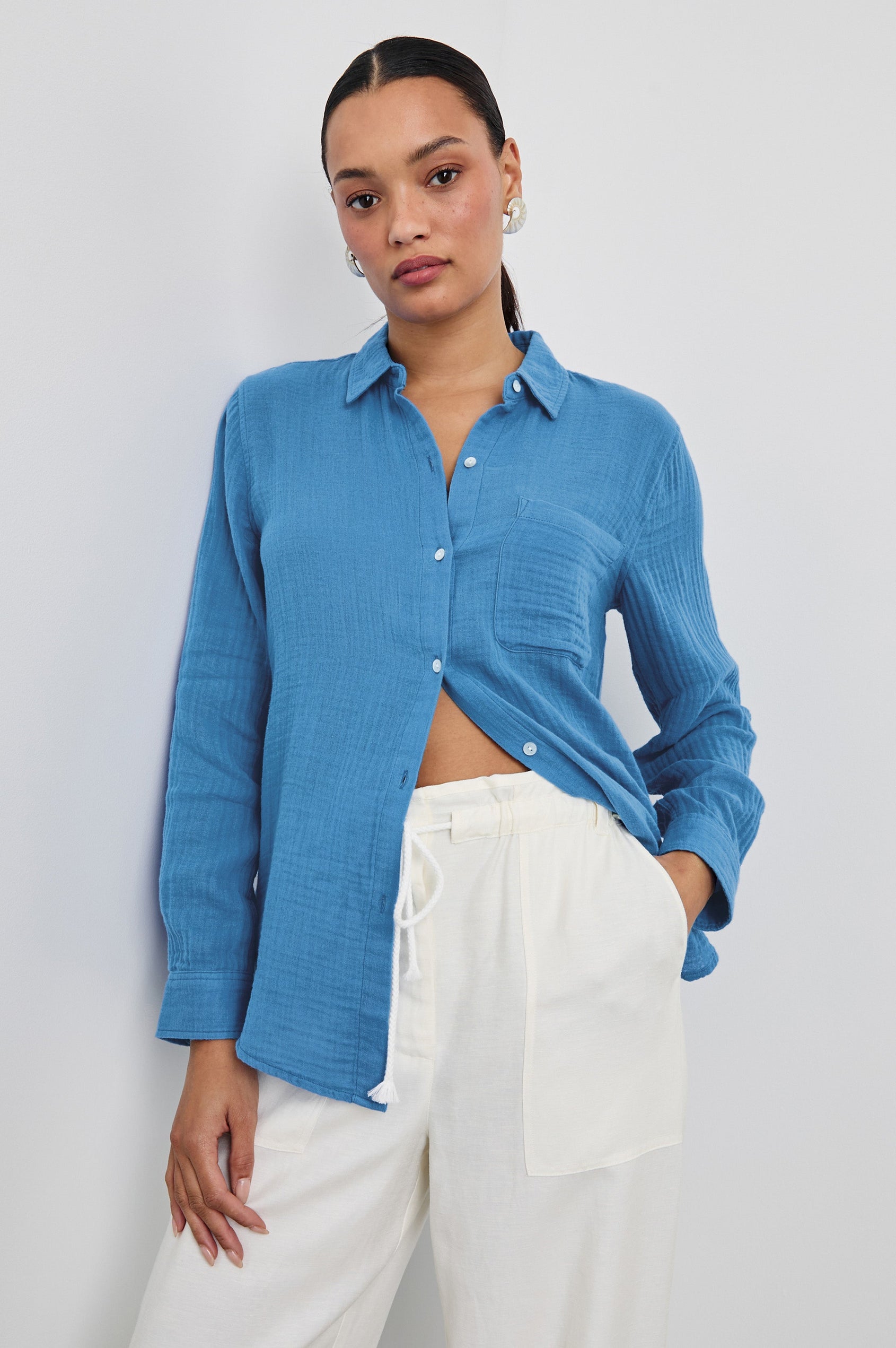 Ellis Relaxed Collared Button Front Shirt with Long Sleeves and a Chest Pocket in French Blue Colorway. Front View Shown on Model.