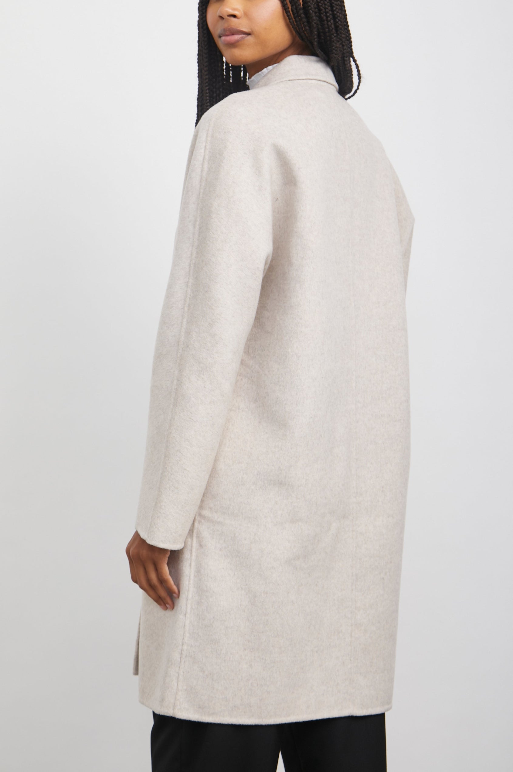 Everest Mid-Thigh Length Coat with Single Button Closure, Notched Lapels and Front Patch Pockets in Oatmeal Colorway - Back Full Body View Featured on Model