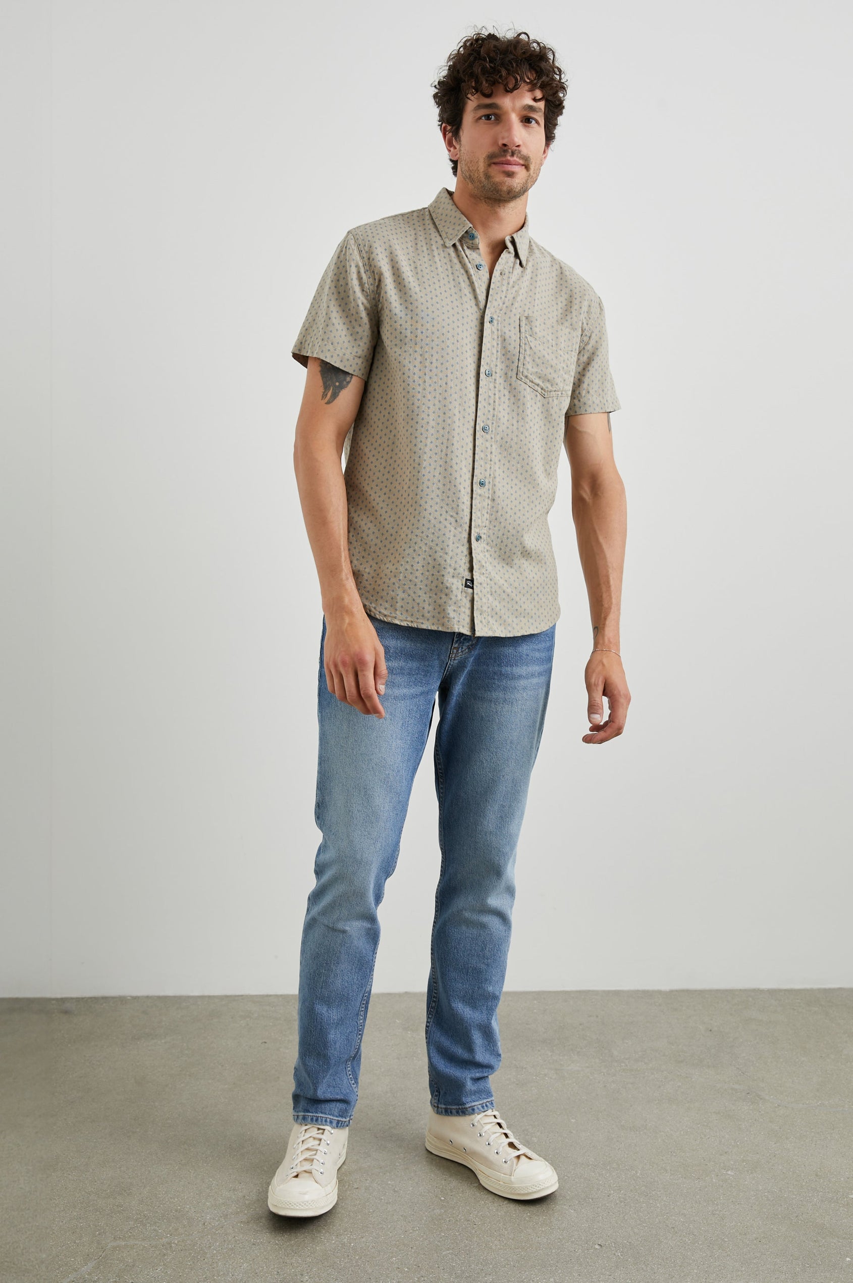 Fairfax Short-Sleeve Button Up with a Chest Patch Pocket in Polygon Micro Quinoa Colorway, with small Grey polygons on Quinoa - Front Full Body View Featured on Model