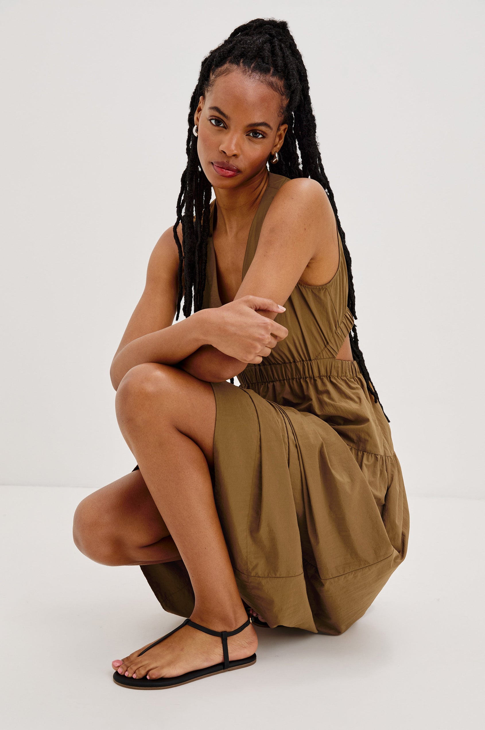 Genevieve Midi Tank Dress with a V-Neck, Elastic Waistband, Cutout at Back Waist and Side Seam Pockets in Sepia Colorway. Side View Shown on Model.