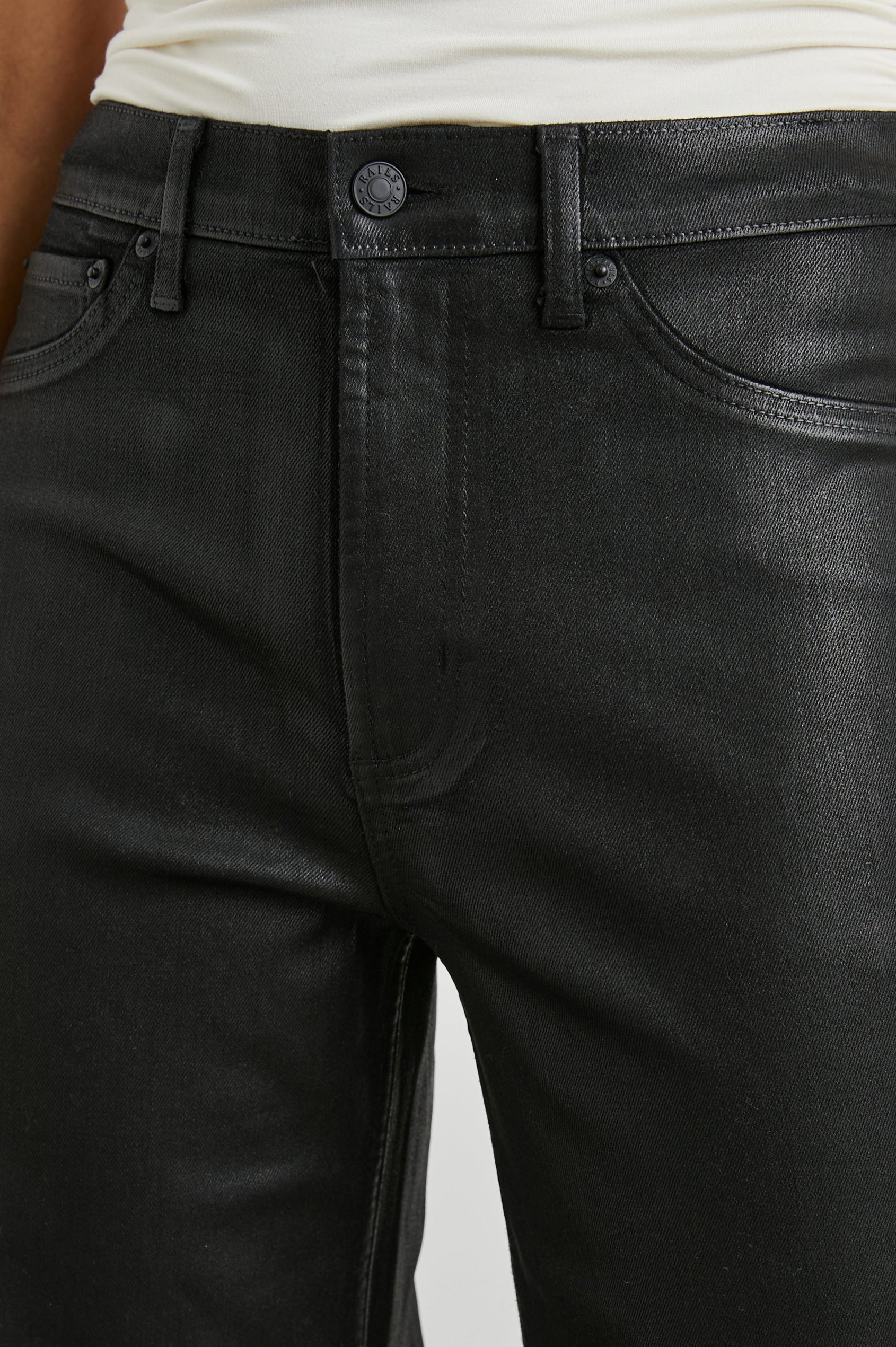 Getty Wide Leg Denim Pants with Belt Loops, Two Front Pockets and Two Back Patch Pockets in Coated Noir Colorway, with a black coating - Front View Featured on Model