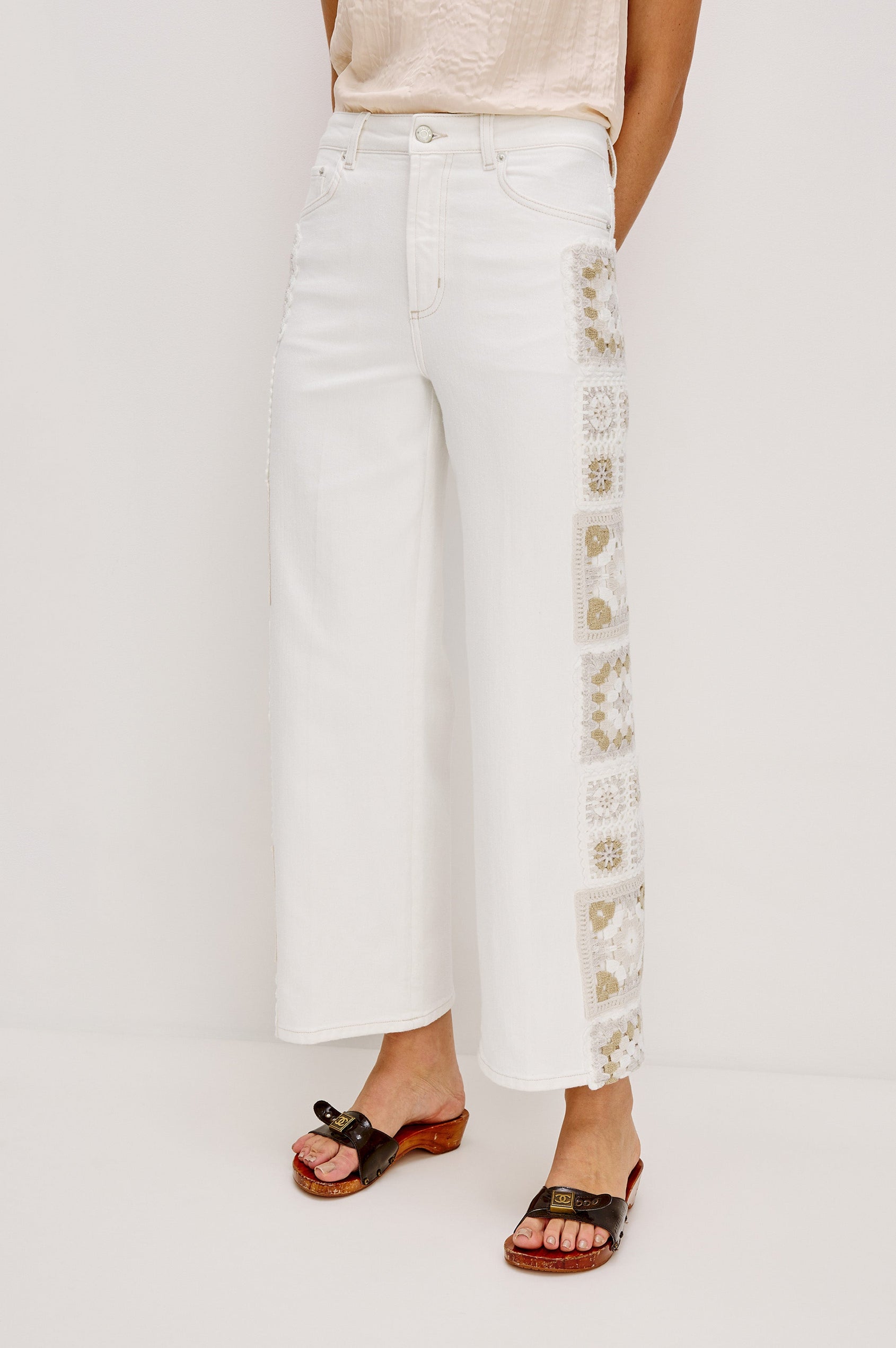 Getty Crop 5-Pocket Denim Pant with Tonal Crochet Side Seam Panels, Traditional Zip and Button Fly and Belt Loops in Vintage Ecru Crochet Colorway. Front View Shown on Model.