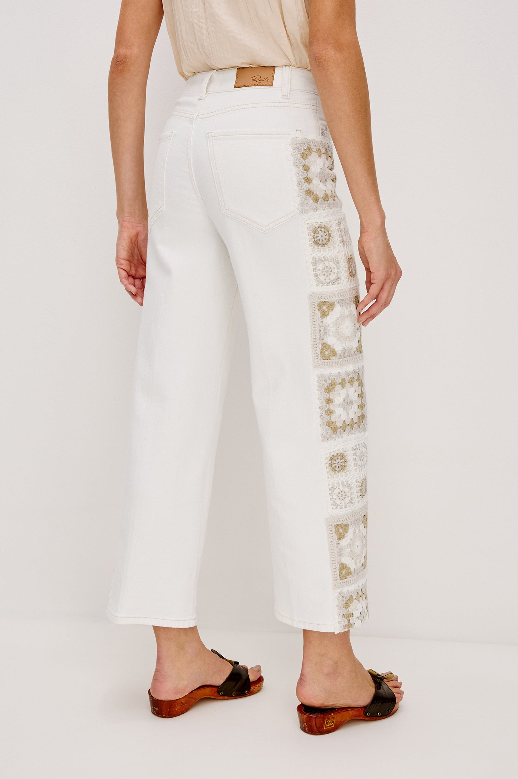 Getty Crop 5-Pocket Denim Pant with Tonal Crochet Side Seam Panels, Traditional Zip and Button Fly and Belt Loops in Vintage Ecru Crochet Colorway. Back View Shown on Model.