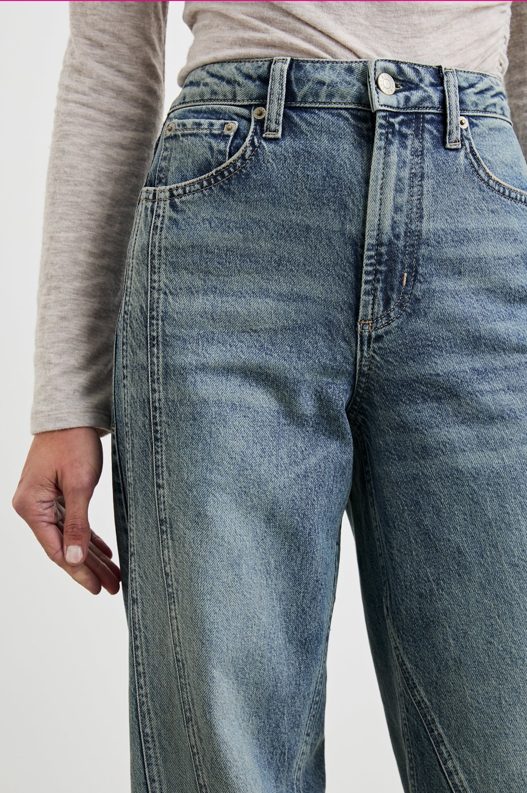 Getty Twist Seam Wide Leg Denim Pants with a Diagonal Seam Across the Leg, Belt Loops, Two Front Pockets and Two Back Patch Pockets in Desert Sky Colorway - Front View Featured on Model