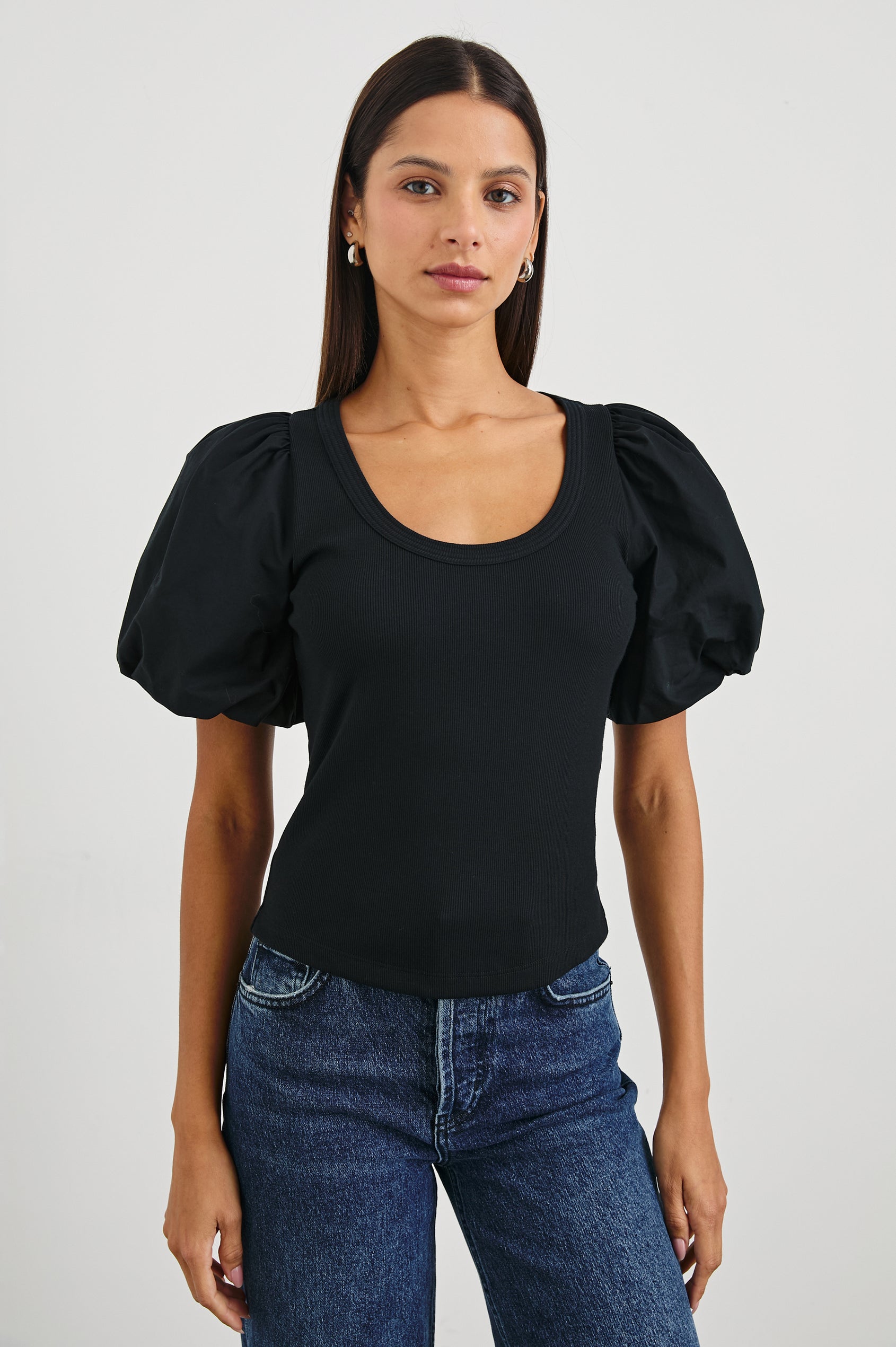 Hallie Short Sleeve Top with a Scoop Neck and Puff Sleeves in Black Colorway - Front View Featured on Model