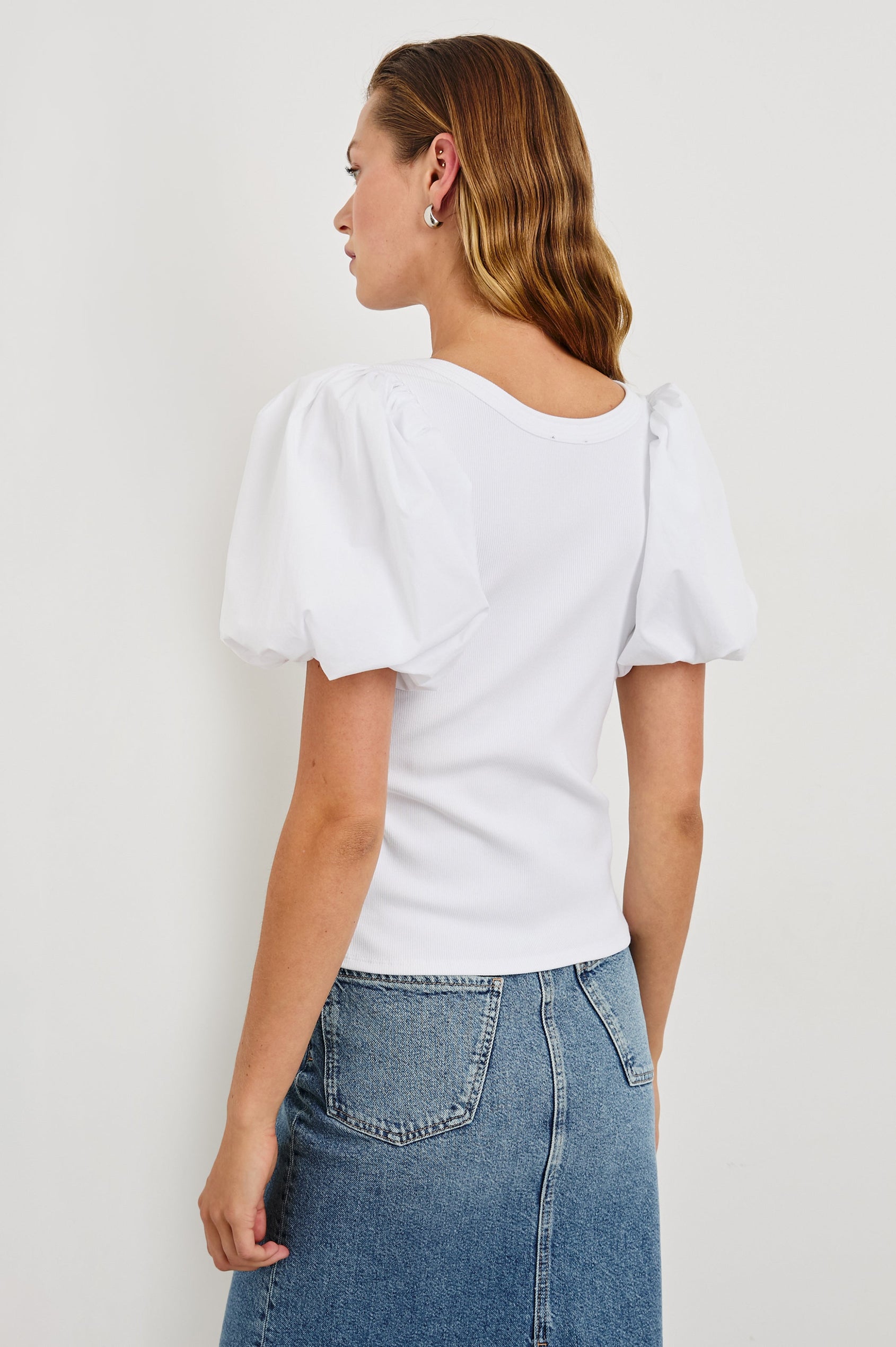 Hallie Short Sleeve Top with a Scoop Neck and Puff Sleeves in White Colorway - Back View Featured on Model