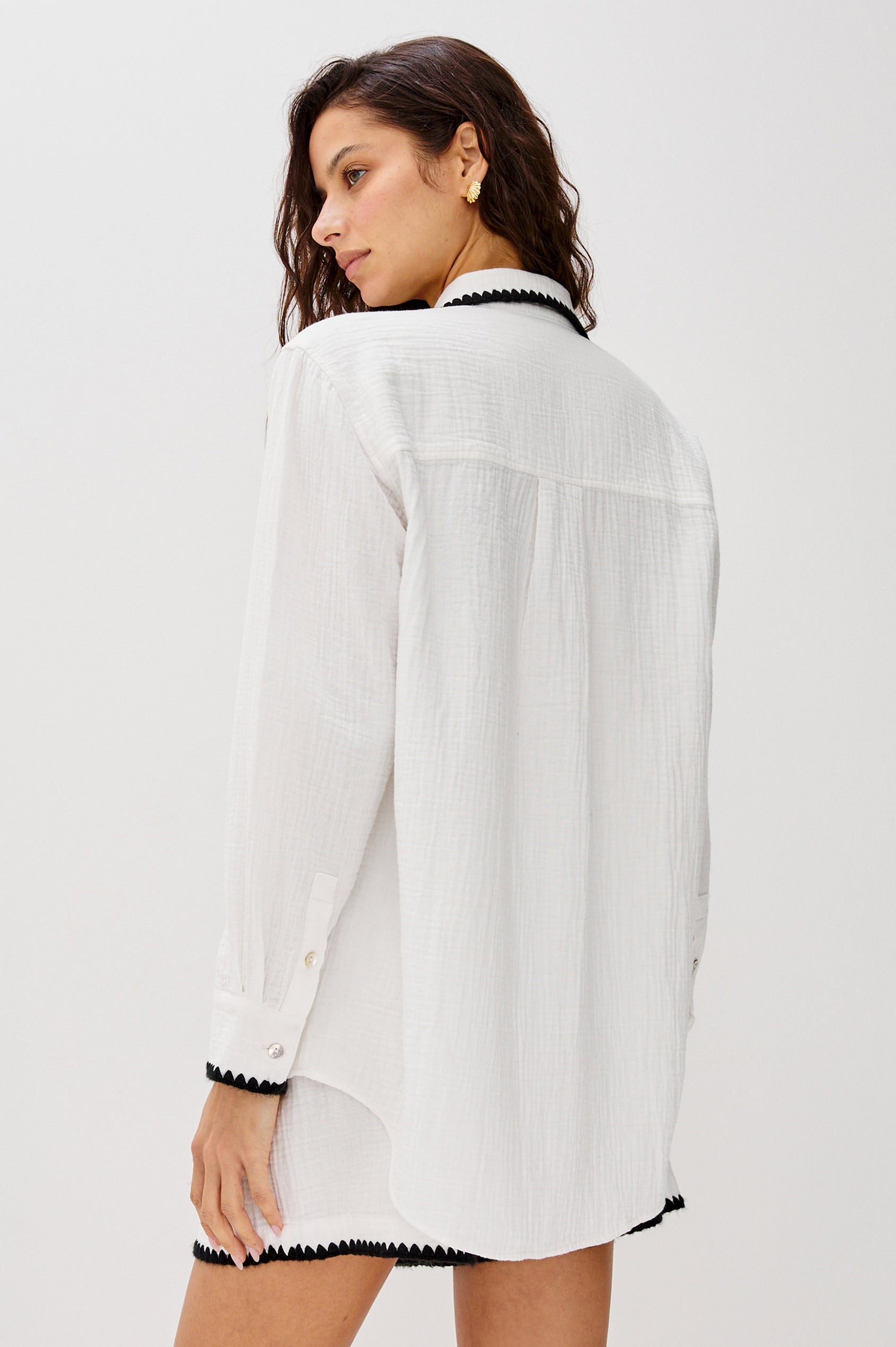 Idania Button Front Collared Shirt with Long Sleeves, Relaxed Fir and a Front Chest Pocket with a White Body in Black Blanket Stich Colorway. Back View Shown on Model.