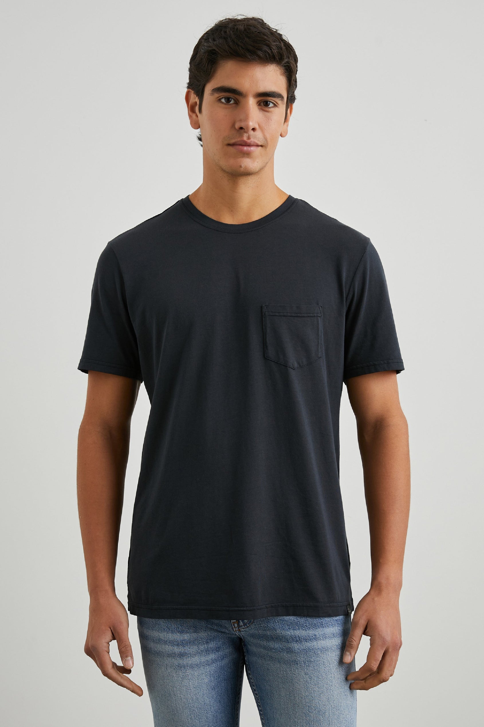 Johnny Short Sleeve T-Shirt with a Crew Neck, Chest Patch Pocket and Small Slits at the Side Hems in Carbon Colorway - Front View Featured on Model