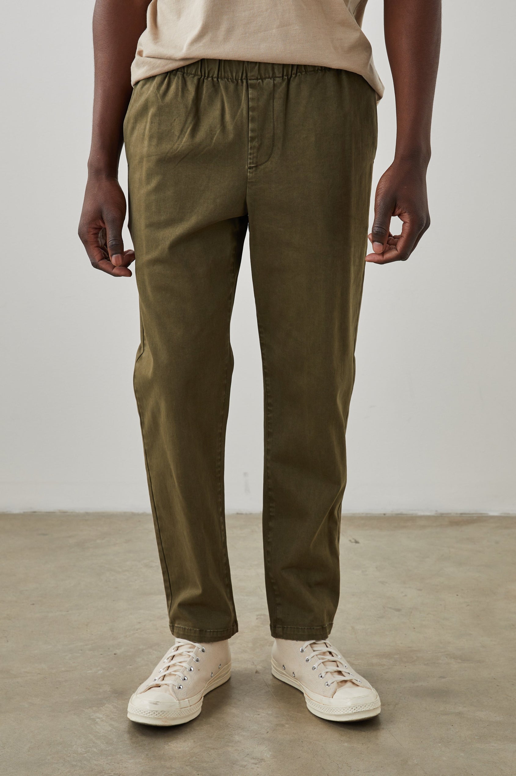 Julian Pants with an Elastic Waist, Two Front Pockets and Two Back Welt Pockets in Moss Colorway - Front View Featured on Model