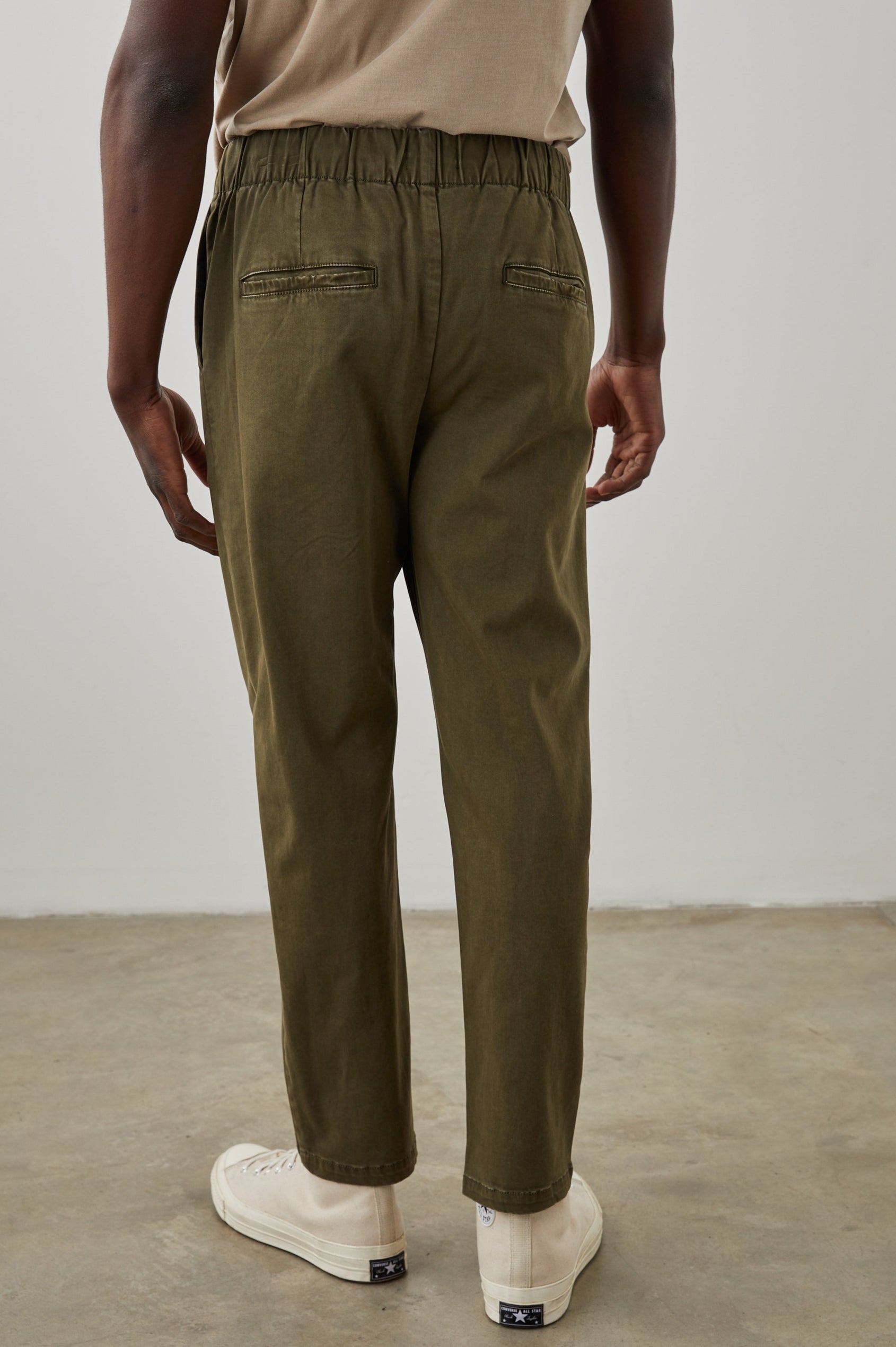 Julian Pants with an Elastic Waist, Two Front Pockets and Two Back Welt Pockets in Moss Colorway - Back View Featured on Model