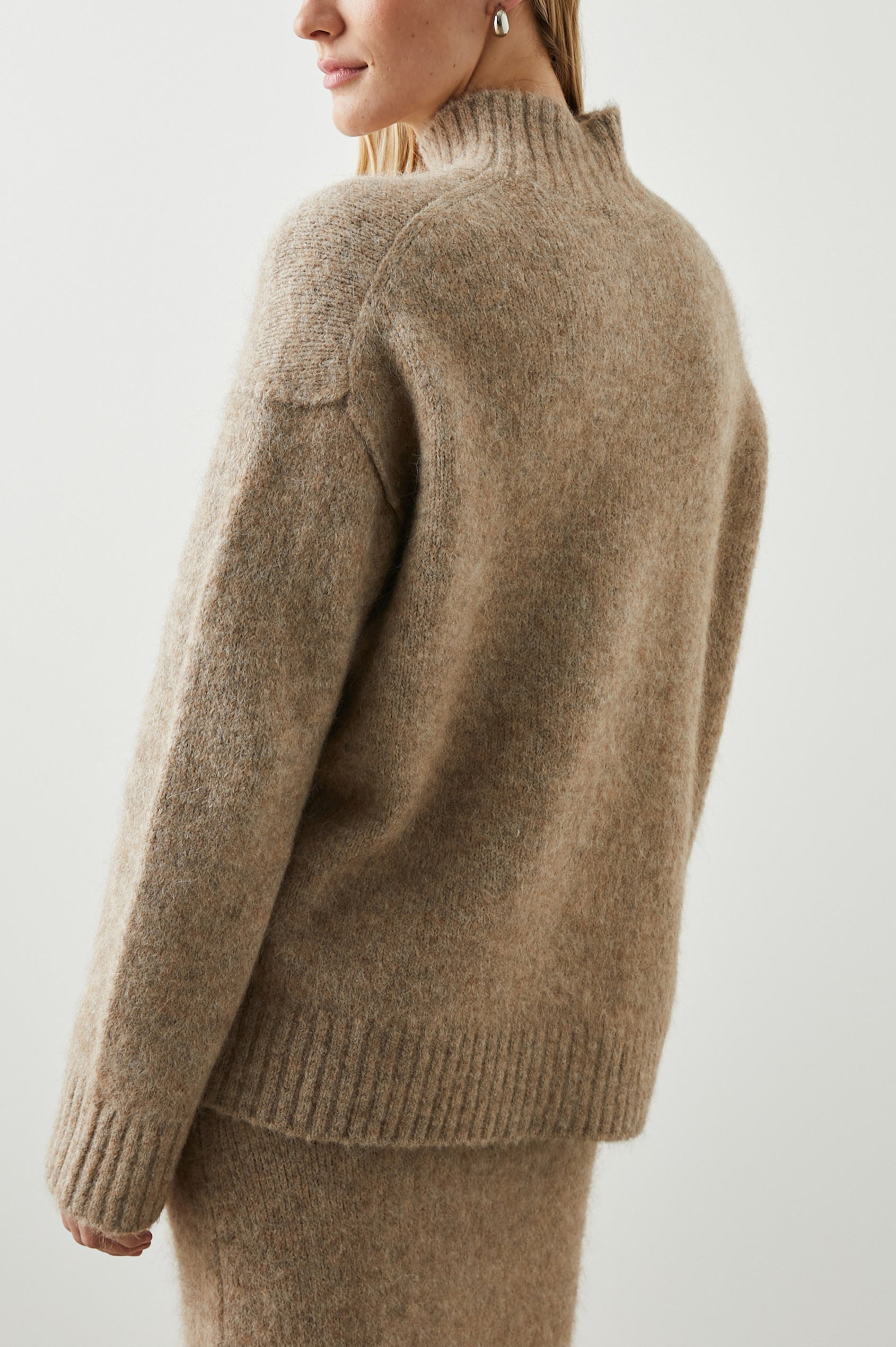 Kacia Long-Sleeve Sweater with a Mock Neck and Ribbed Trim in Oatmeal Colorway - Back View Featured on Model