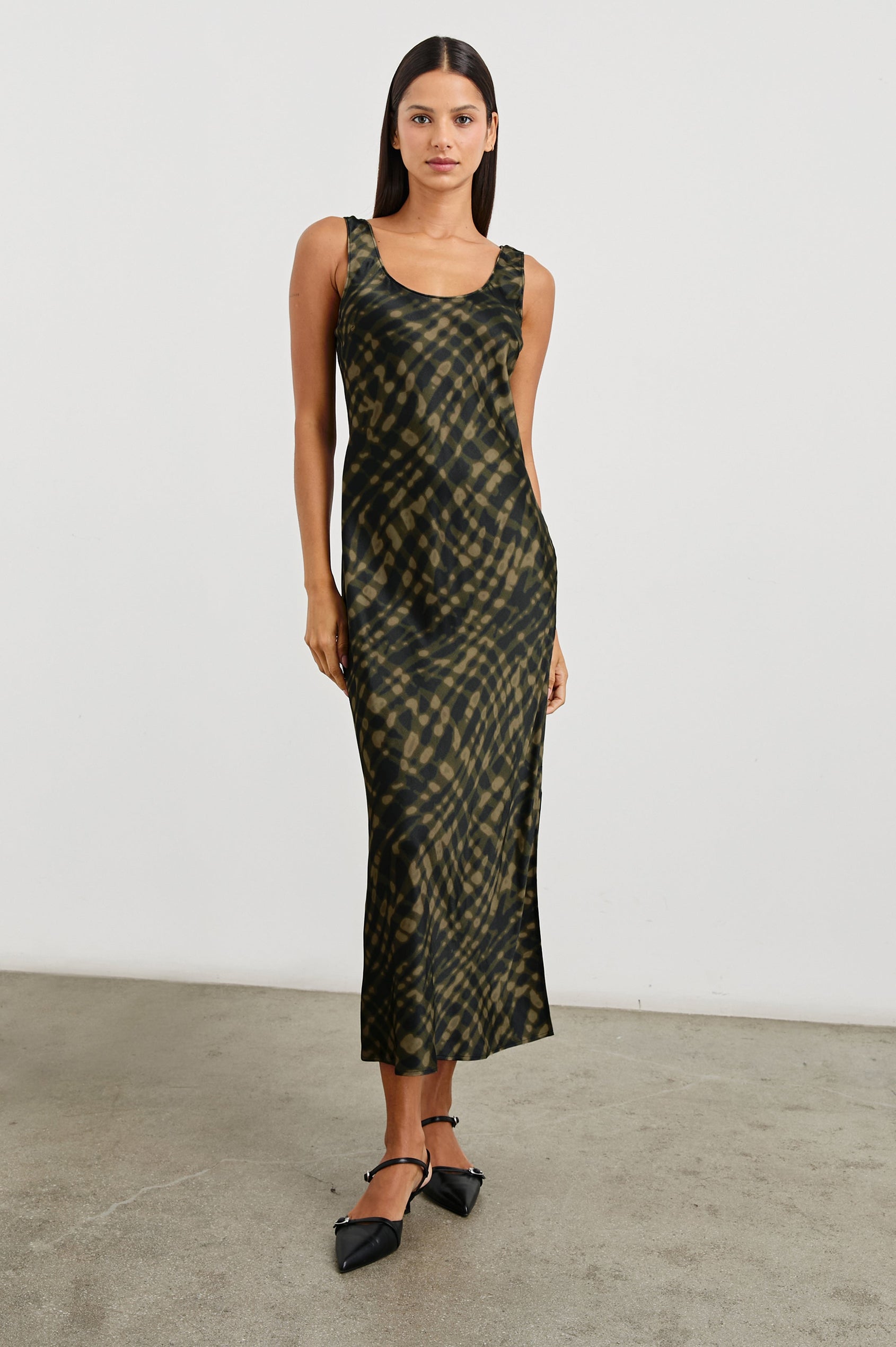 Kailani Sleeveless Midi Dress with Shoulder Straps, a Scoop Neck and Side Slit to the Knee in Cypress Colorway, a pattern in greens - Front Full Body View Featured on Model
