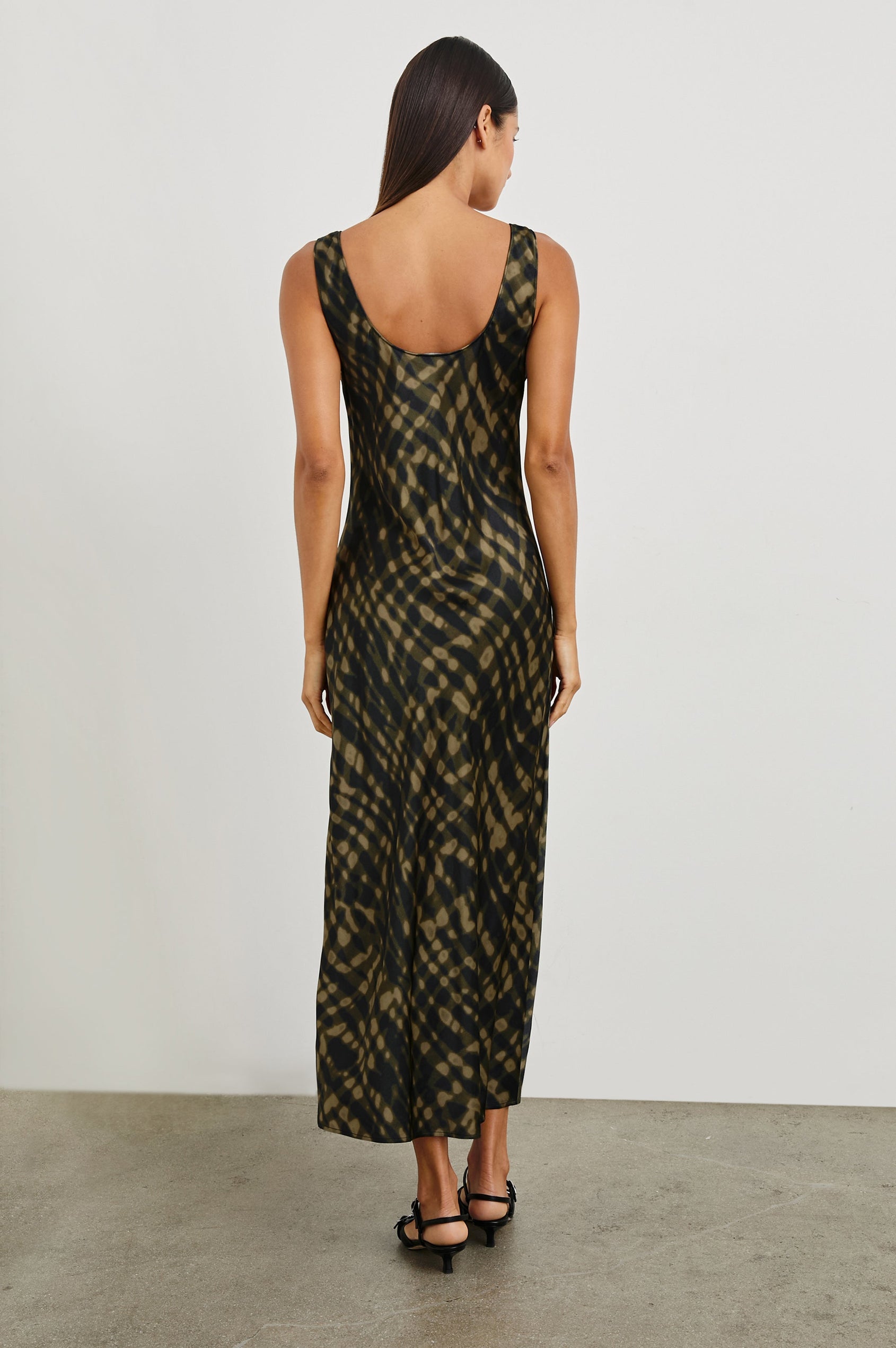 Kailani Sleeveless Midi Dress with Shoulder Straps, a Scoop Neck and Side Slit to the Knee in Cypress Colorway, a pattern in greens - Back Full Body View Featured on Model