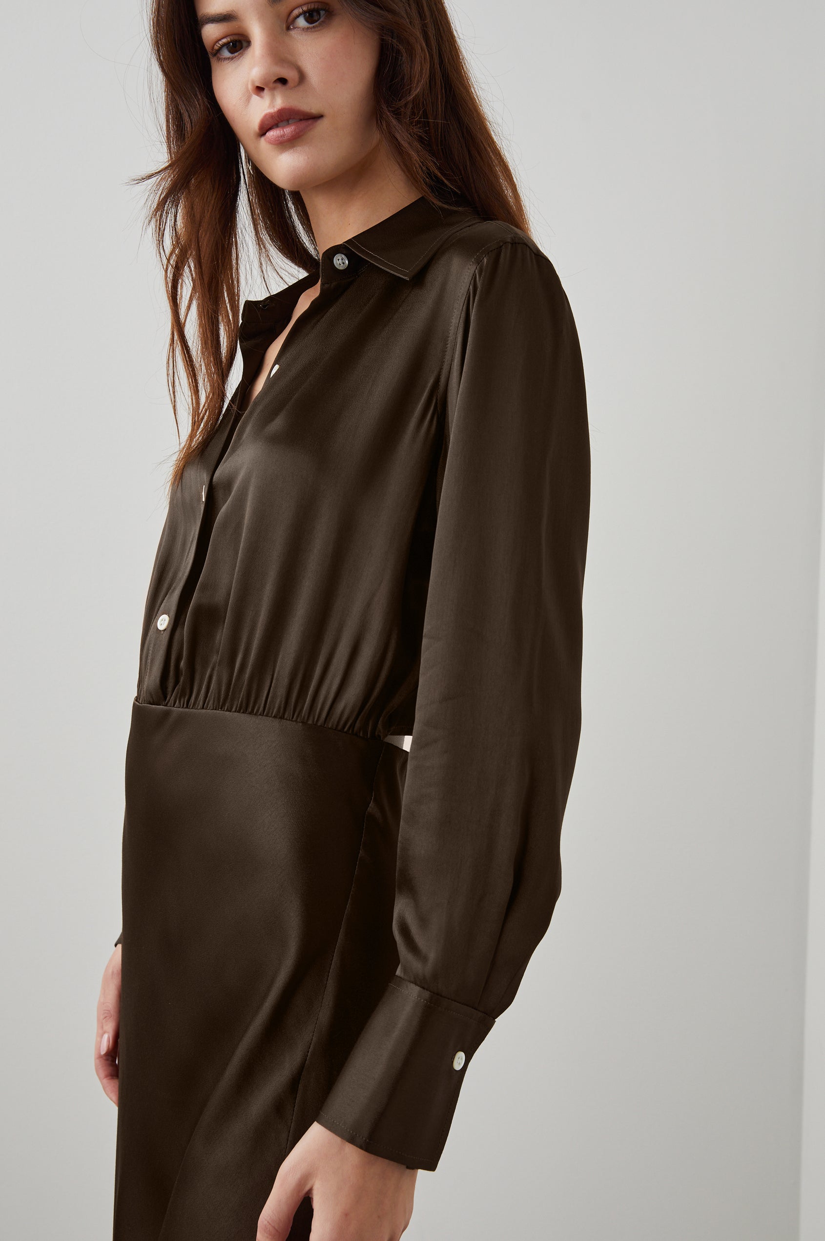 Kathleen Long-Sleeve Midi Dress with Buttons Down the Bodice, a Collar, Buttoned Cuffs, and a Side Thigh Slit in Dark Moss Colorway - Side View Featured on Model