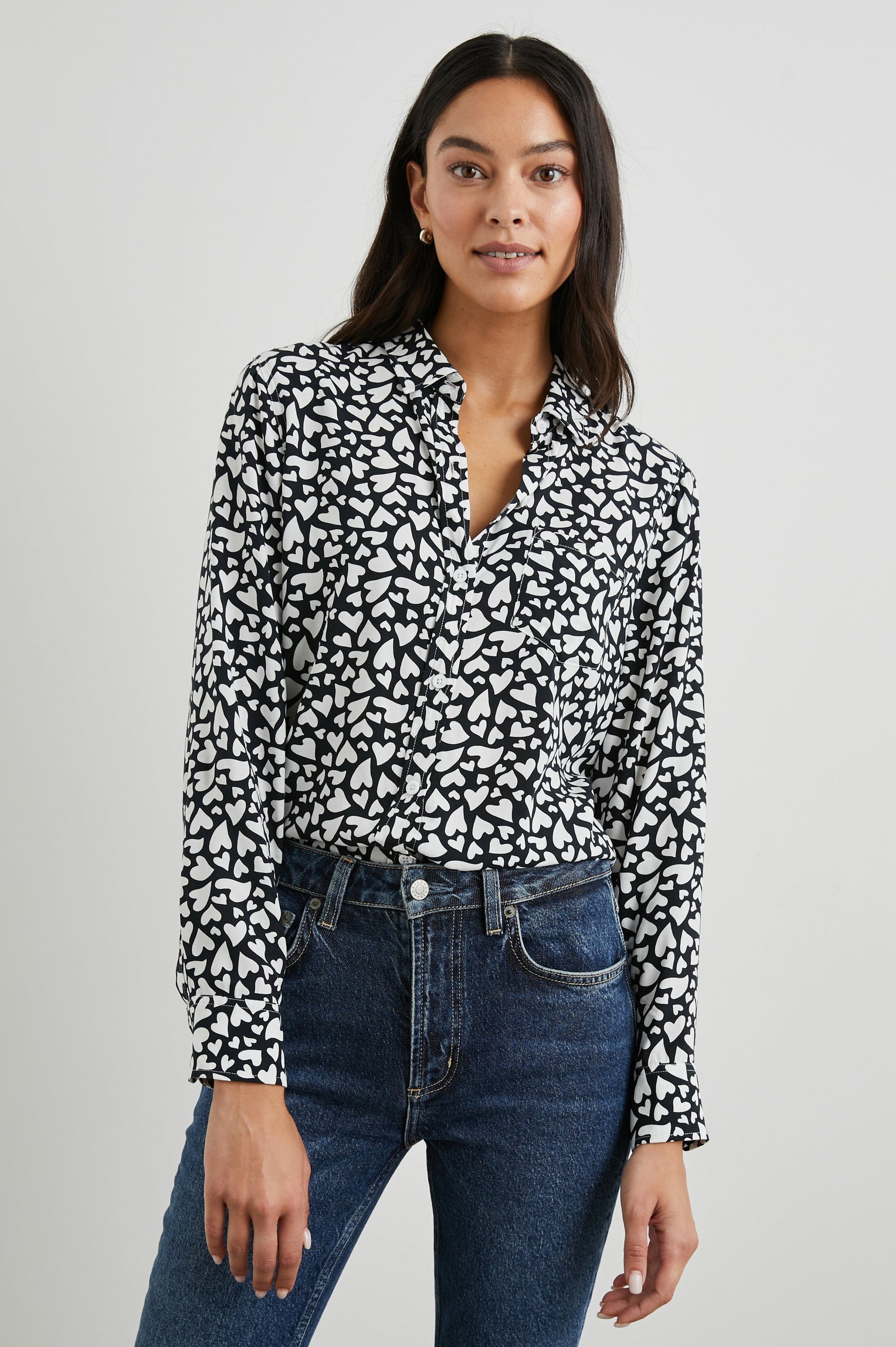 Kathryn Long-Sleeve Button up with a Chest Patch Pocket in Amore Colorway, with white hearts on black - Front View Featured on Model