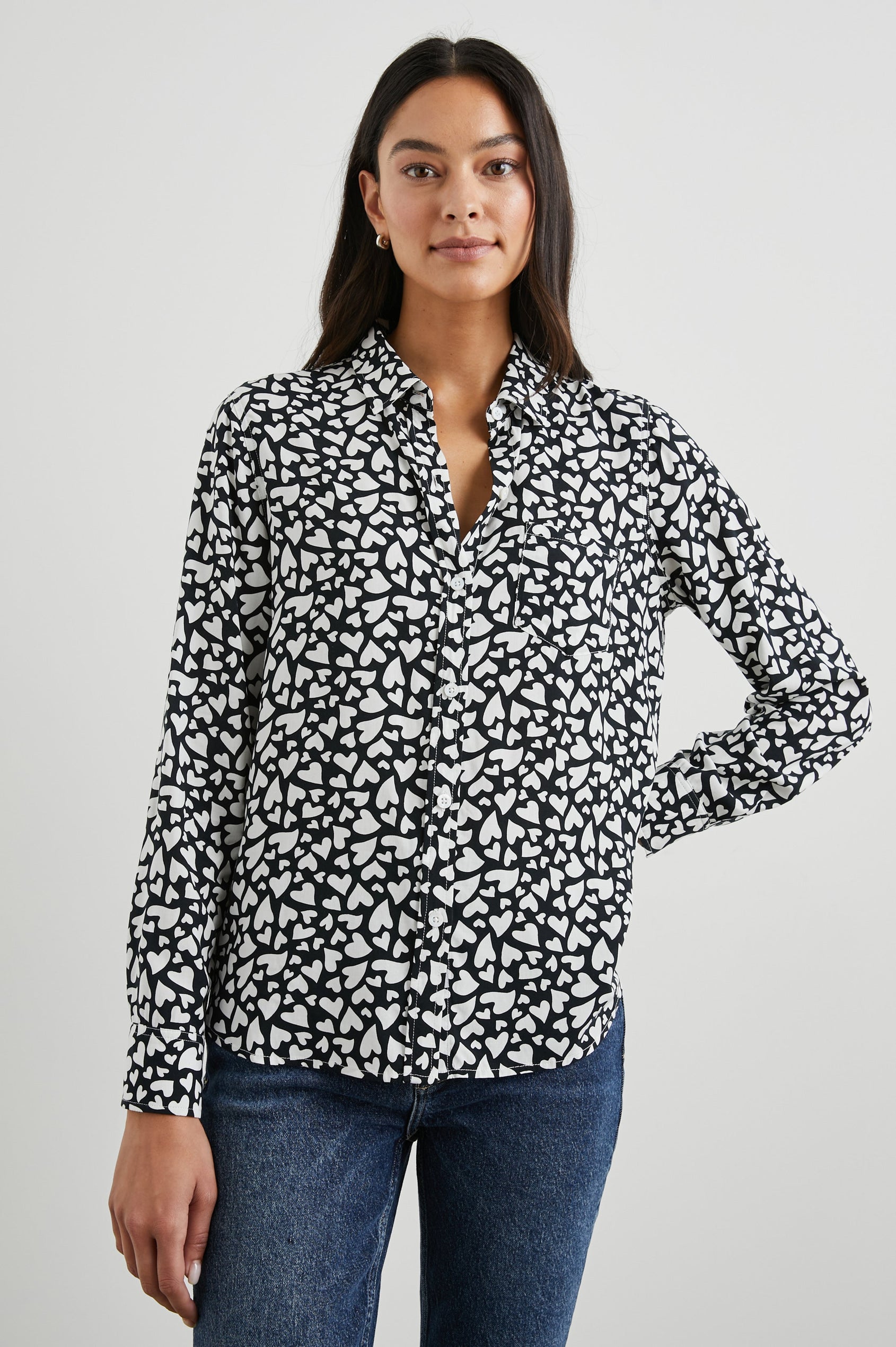 Kathryn Long-Sleeve Button up with a Chest Patch Pocket in Amore Colorway, with white hearts on black - Front View Featured on Model