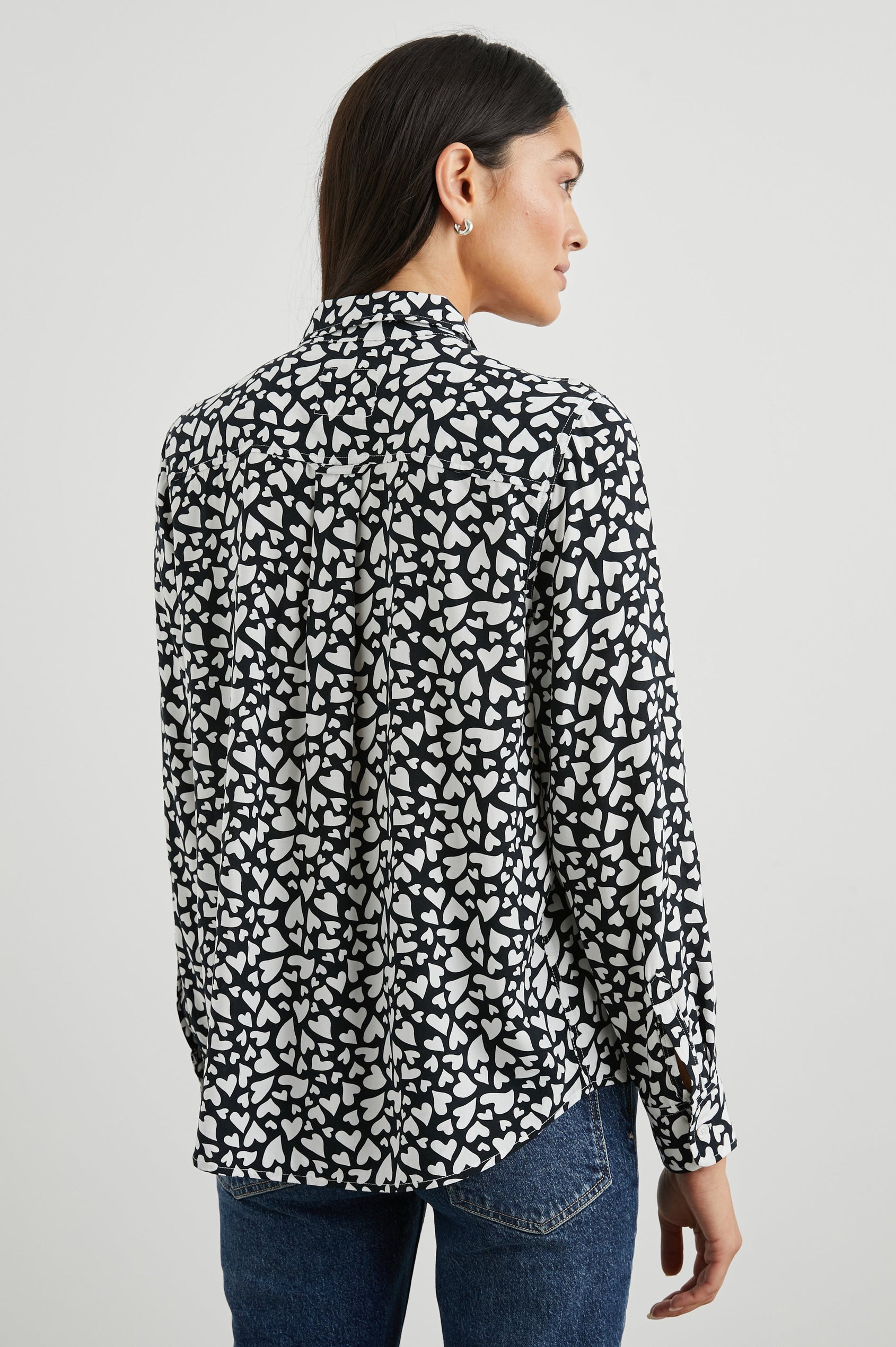 Kathryn Long-Sleeve Button up with a Chest Patch Pocket in Amore Colorway, with white hearts on black - Back View Featured on Model
