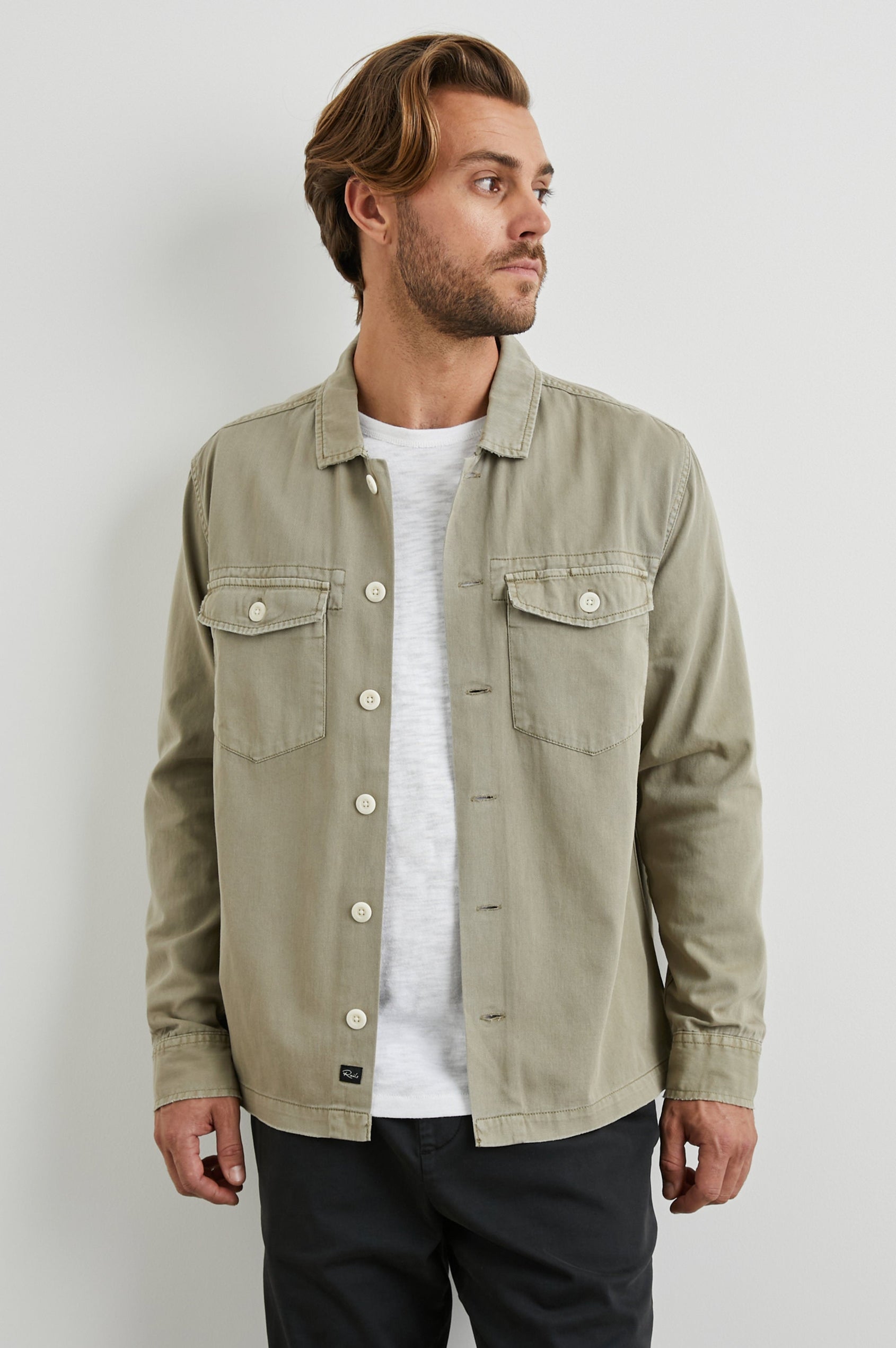 Kerouac Long-Sleeve Shirt Jacket with Button Closure and Two Button Chest Flap Pockets in Natural Colorway - Front Unbuttoned View Featured on Model