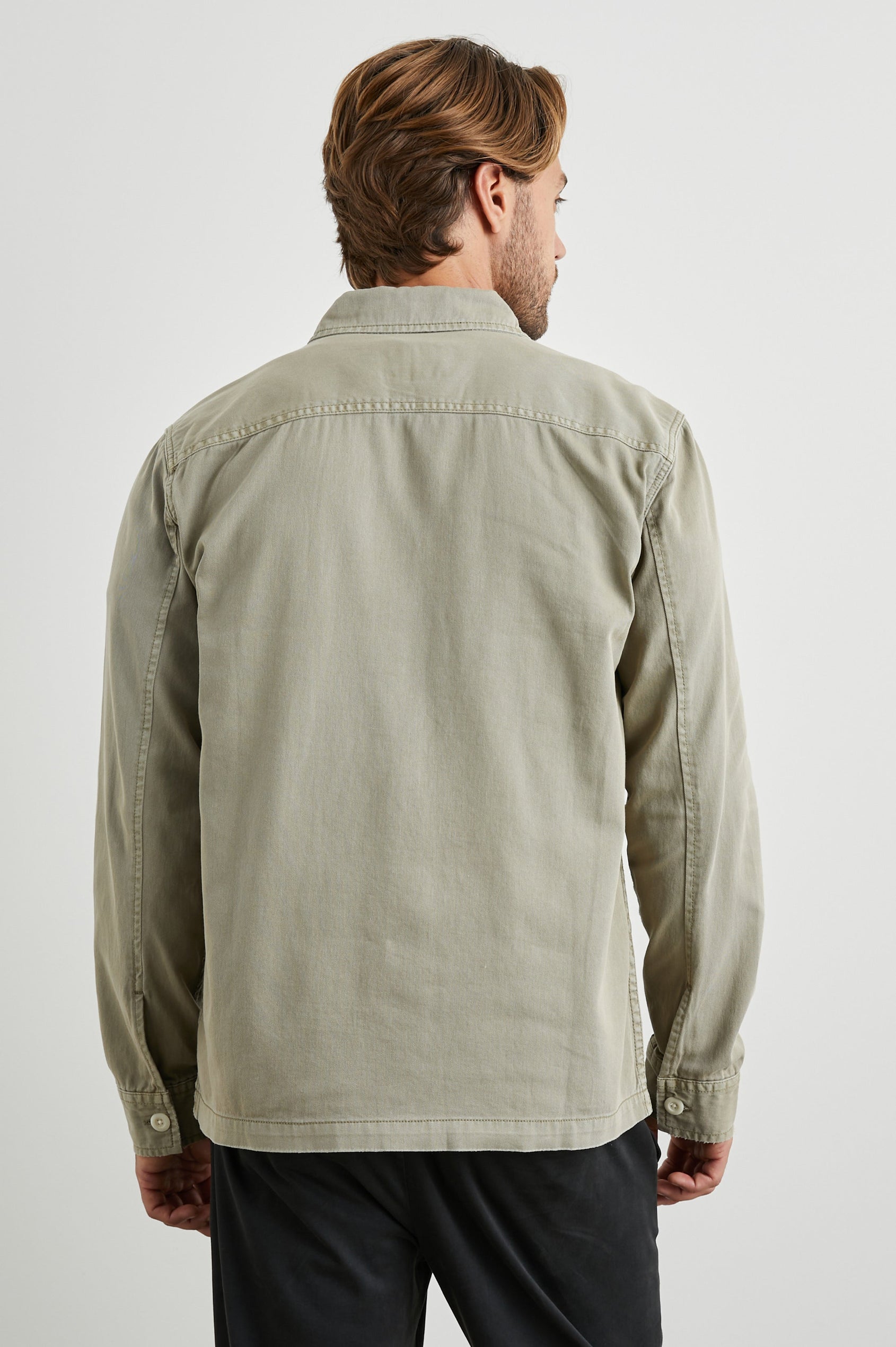 Kerouac Long-Sleeve Shirt Jacket with Button Closure and Two Button Chest Flap Pockets in Natural Colorway - Back View Featured on Model