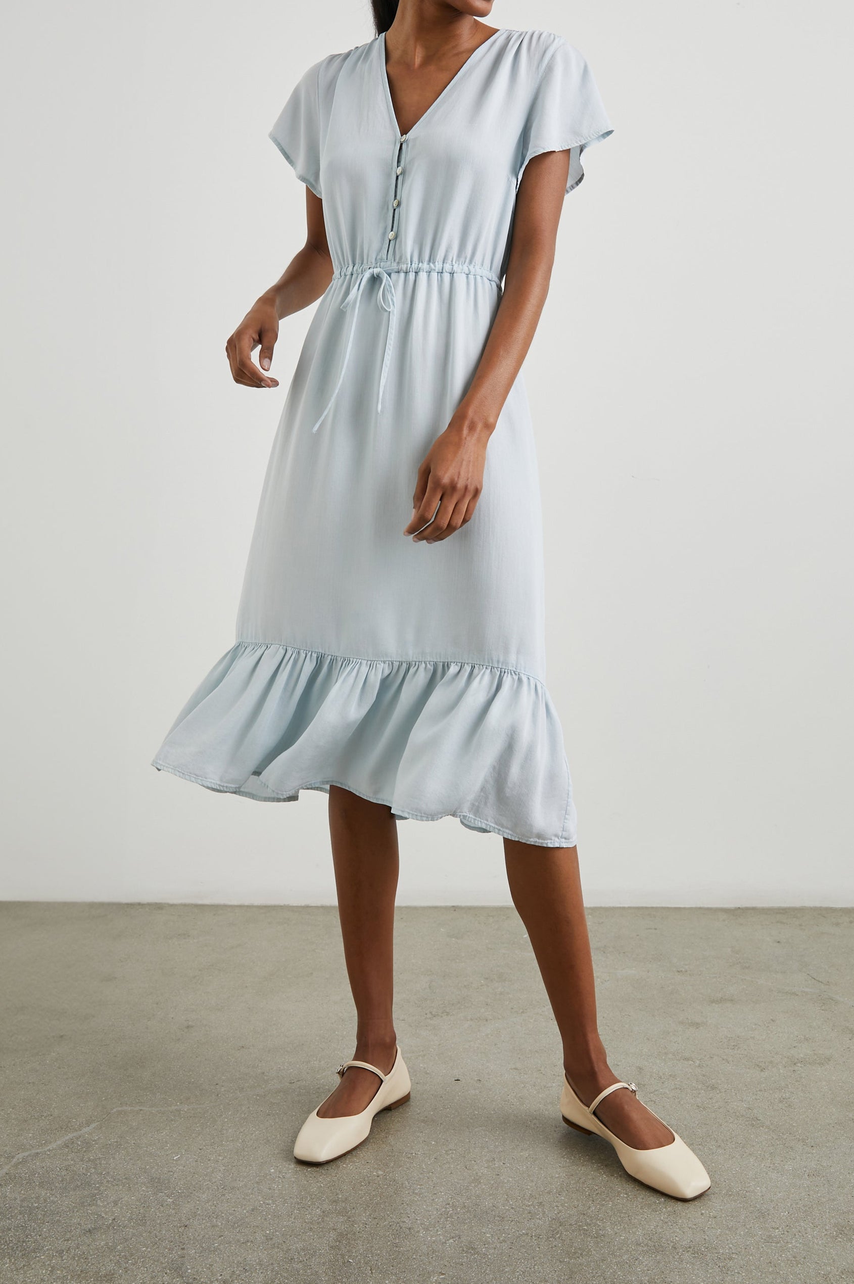 Kiki Short Sleeve Midi Dress with a V Neck, Buttons Down the Front Bodice, a Drawstring Waist and Ruffles at the Hem in Light Vintage Colorway - Front Full Body View Featured on Model